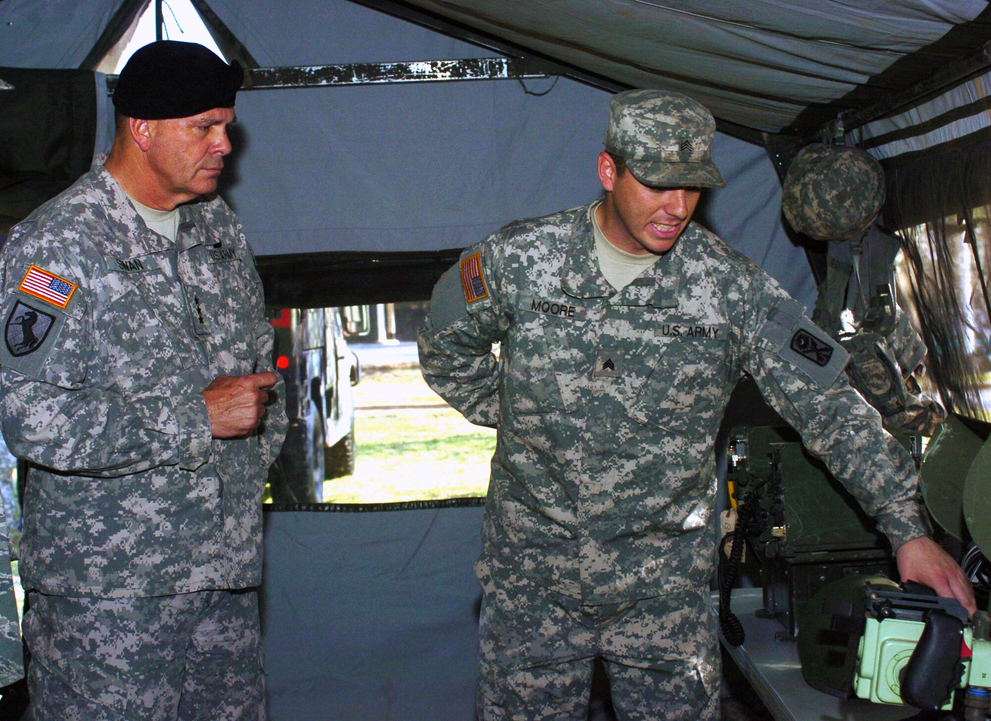 Army Lt. Gen. Guy Swan III, U.S. Army North’s (ARNORTH) commanding general, is briefed by a South Carolina Guardsmen during his visit to the 263rd Army Air and Missile Defense Command’s Deployable Integrated Air Defense System Minimum Deployment Package in Anderson, S.C., April 1, 2010. He was accomapanied by Air Force Maj. Gen. Garry C. Dean, the commander of 1st Air Force. (Courtesy photo)