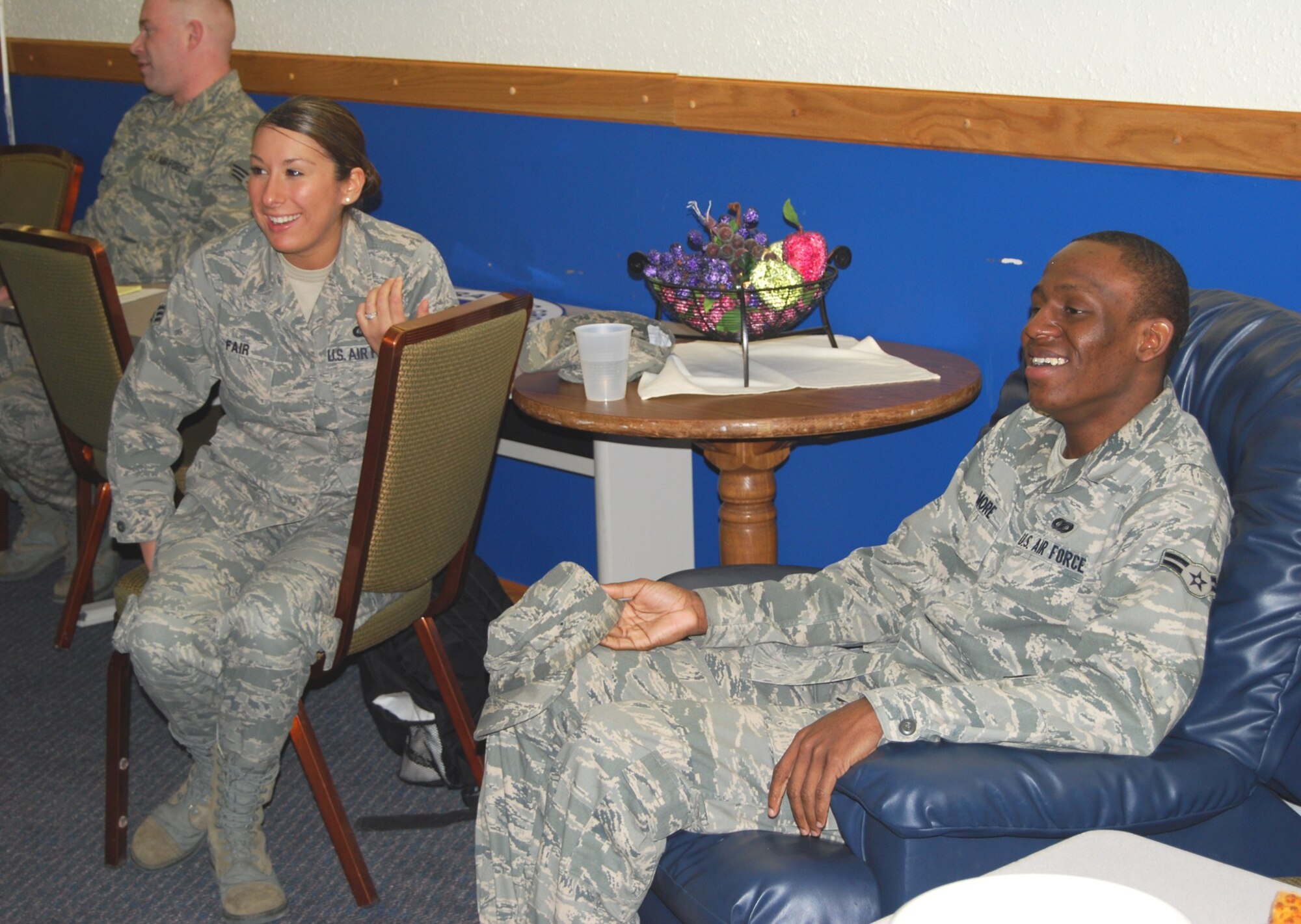 Senior Airman Ibbet Fair and Airman 1st Class Quintin Gilmore, 341st Operations Group knowledge operators, enjoy a few laughs at the Airman's Council meeting April 9 at the Grizzly Bend Club. (U.S. Air Force photo/Airman 1st Class Kristina Overton)