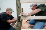 Kirk Heyman (left) and Jeff Holub with JLS Holub Enterprises, check the level of a rail outside the temporary firehouse living quarters April 12. (U.S. Air Force photo by Steve Thurow)