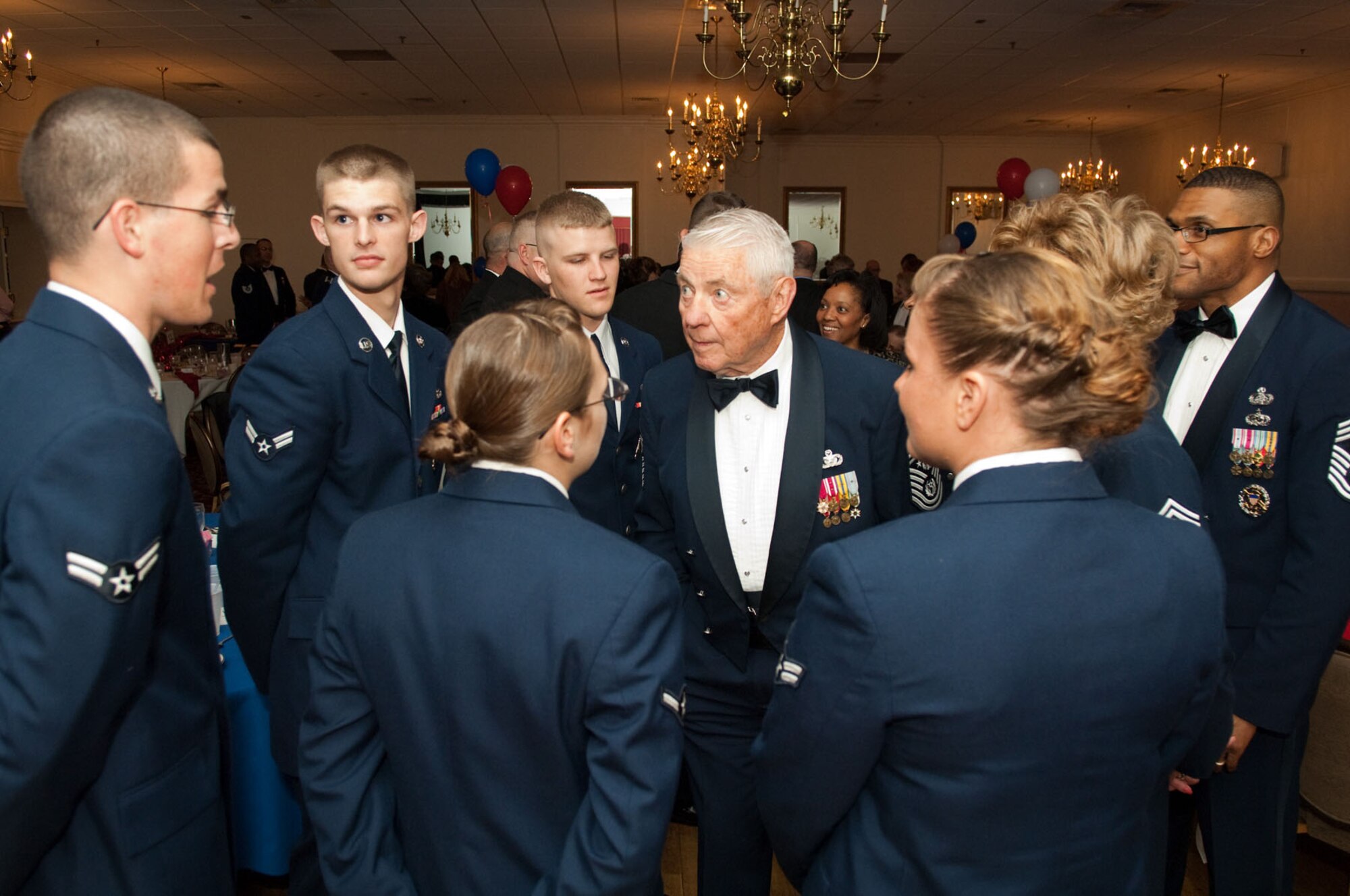 HANSCOM AIR FORCE BASE, Mass. – Retired Chief Master Sgt. Robert D. Gaylor (middle), fifth Chief Master Sergeant of the Air Force, talks with Airmen during the Chiefs Recognition Ceremony on April 9 at the Minuteman Club. (U.S. Air Force photo by Rick Berry)