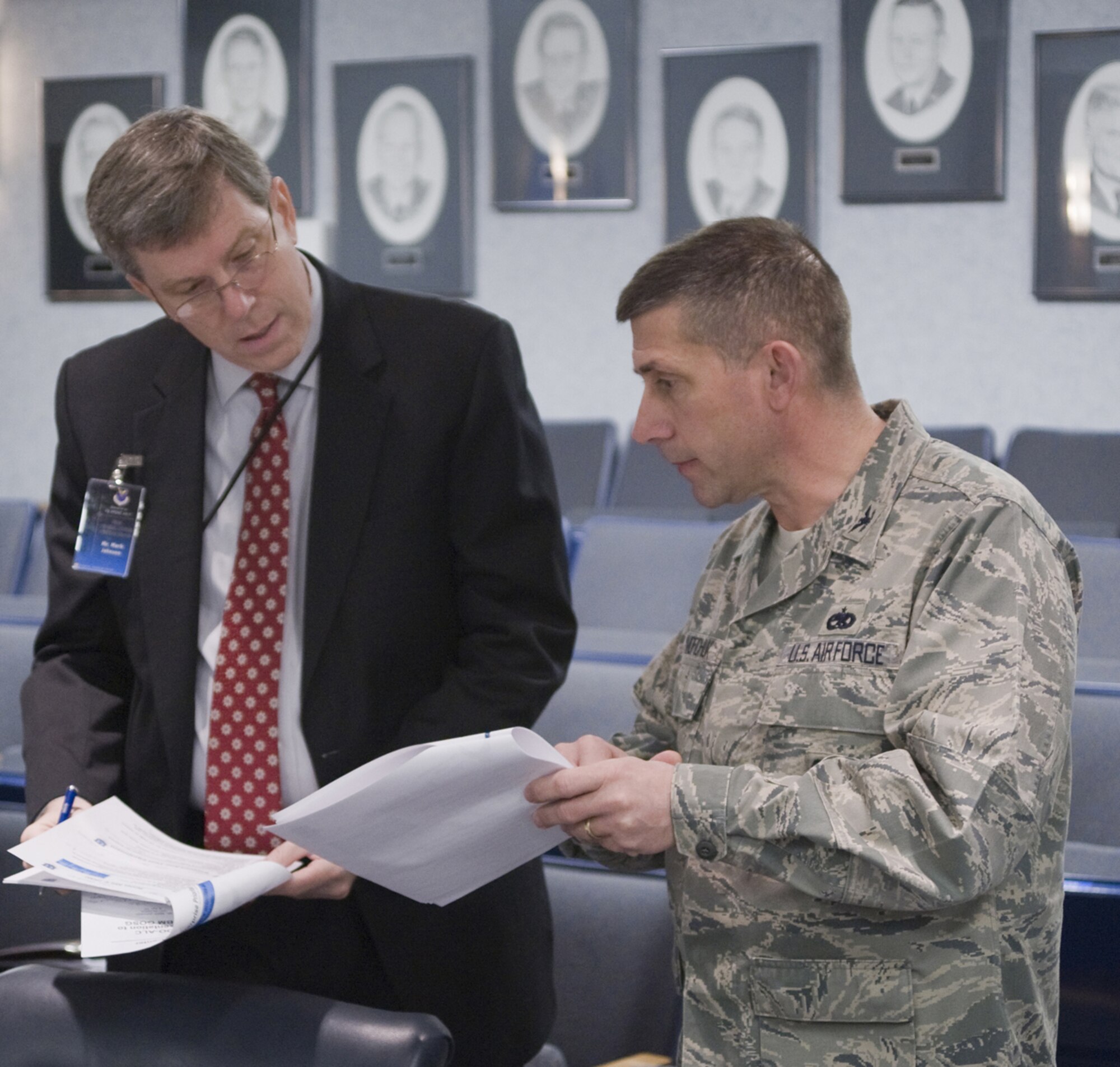 Mr. Mark Johnson, Executive Director, Ogden Air Logistics Center, and Col. Randy Tymofichuk, 309th Missile Maintenance Group commander at Hill Air Force Base, Utah, where OO-ALC is based, discuss information prior to the start of the ICBM Sustainment General Officer Steering Group at Malmstrom AFB, Mont., April 8. (U.S. Air Force photo/Beau Wade)