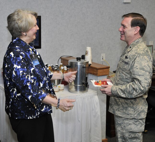 Ms. Ann Mitchell, Air Force Global Strike Command A4/7, and Brig. Gen. Jeffry Smith, AFGSC A5/8, exchange greetings before the start of the ICBM Sustainment General Officer Steering Group meeting at Malmstrom April 8. (U.S. Air Force photo/John Turner)