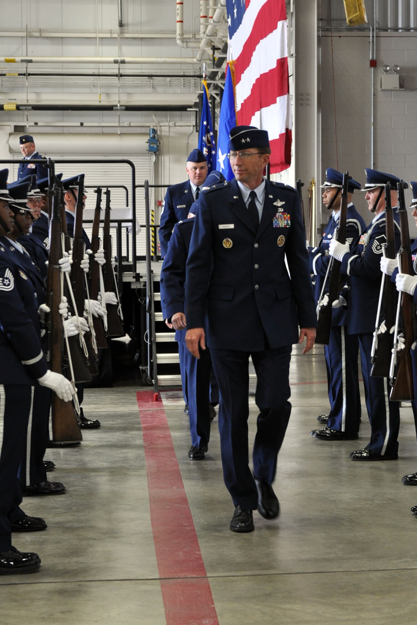 YOUNGSTOWN AIR RESERVE STATION, Ohio -- Air Force Reserve Maj. Gen. James T. Rubeor, commander of the 22nd Air Force departs the stage in a hangar here after a wing change of command ceremony, April 11. Col. Fritz Linsenmeyer assumed command of the 910th Airlift Wing from Col. Karl McGregor during the event. Col. McGregor assumed command of the 452nd Air Mobility Wing at March Air Reserve Base, Calif., March 27. Col. Linsenmeyer's previous assignment was commander of the 916th Air Refueling Wing, an Air Force Reserve unit at Seymour Johnson Air Force Base, NC. As commander of the 910th, Col. Linsenmeyer is the leader of more than 1800 Citizen Airmen, Air Reserve Technicians and civil service employees and has operational control of 12 C-130H tactical cargo transport aircraft. U.S. Air Force photo by Senior Airman Brenda Haines.    
