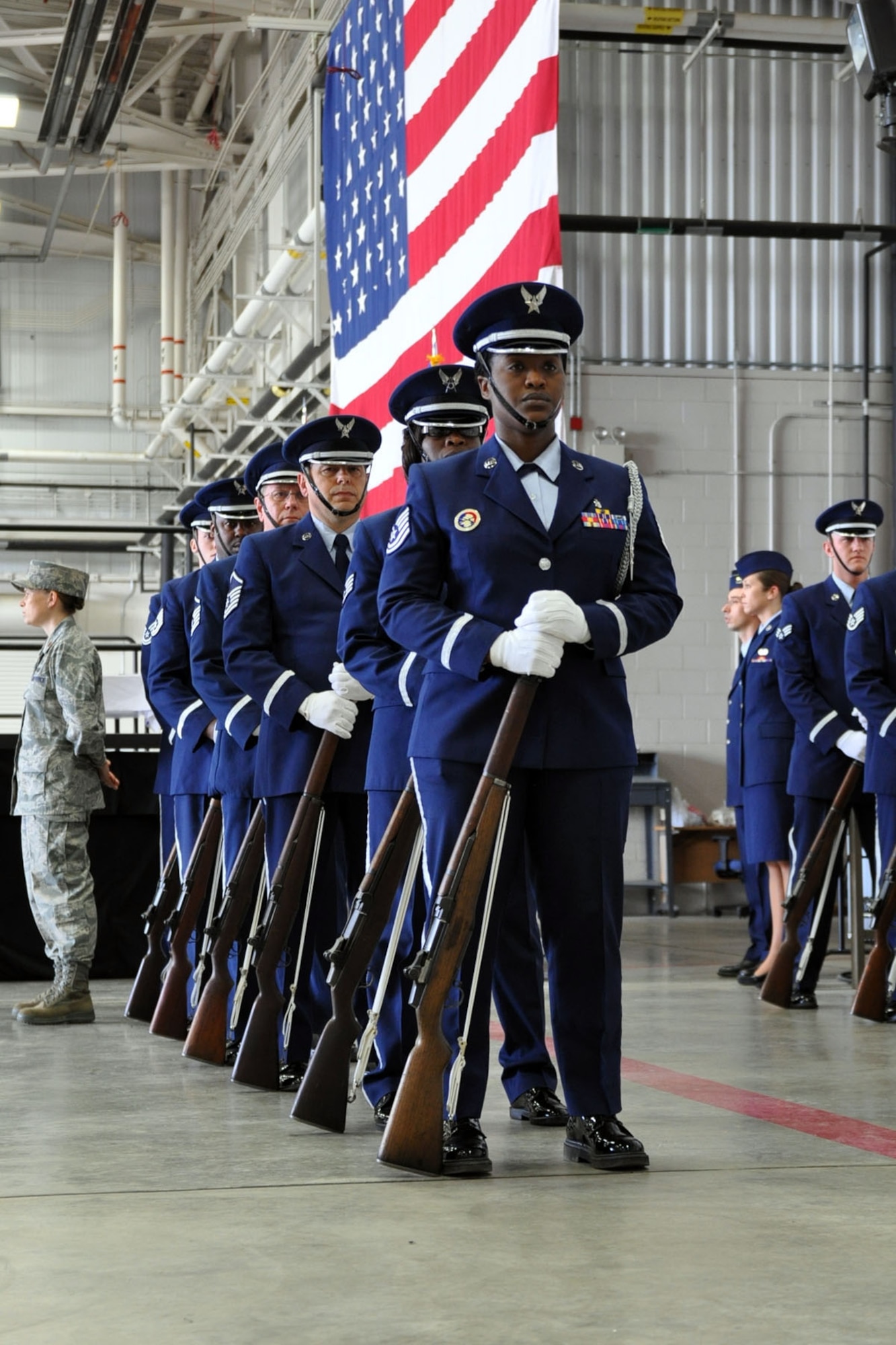 YOUNGSTOWN AIR RESERVE STATION, Ohio -- Air Force Reserve honor cordon waits the start of a wing change of command ceremony in a hangar here, April 11. Col. Fritz Linsenmeyer assumed command of the 910th Airlift Wing from Col. Karl McGregor during the event. Col. McGregor assumed command of the 452nd Air Mobility Wing at March Air Reserve Base, Calif., March 27. Col. Linsenmeyer's previous assignment was commander of the 916th Air Refueling Wing, an Air Force Reserve unit at Seymour Johnson Air Force Base, NC. As commander of the 910th, Col. Linsenmeyer is the leader of more than 1800 Citizen Airmen, Air Reserve Technicians and civil service employees and has operational control of 12 C-130H tactical cargo transport aircraft. U.S. Air Force photo by Senior Airman Brenda Haines.    