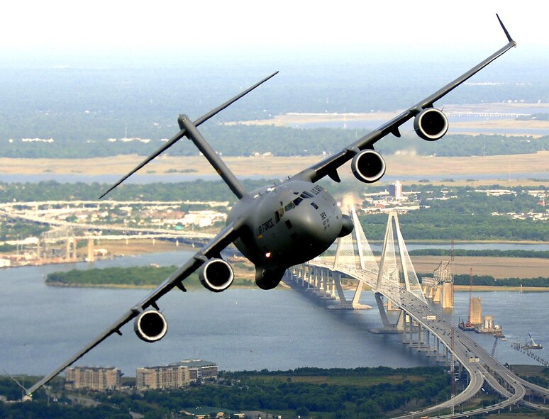 A C-17 Globemaster III from Charleston Air Force Base, S.C., banks over the Arthur J. Ravenel Bridge in Charleston, S.C., during a training mission May 16, 2006. Charleston's 315th Airlift Wing is one of eight Air Force Reserve Command units providing airlift support for the troop surge in Afghanistan. (U.S. Air Force photo/Tech. Sgt. Russell E. Cooley IV)