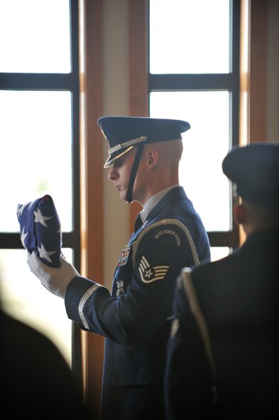 MANDAN, N.D. – Staff Sgt. Ernest Willich, 91st Missile Security Forces Squadron command support staff noncommissioned officer-in-charge, prepares to present the United States flag at the North Dakota Veterans Cemetery in Mandan, N.D., April 12. The purpose of the base honor guard is to give honor to military members during a variety of ceremonies, including funerals. (U.S. Air Force photo by Senior Airman Ashley N. Avecilla)