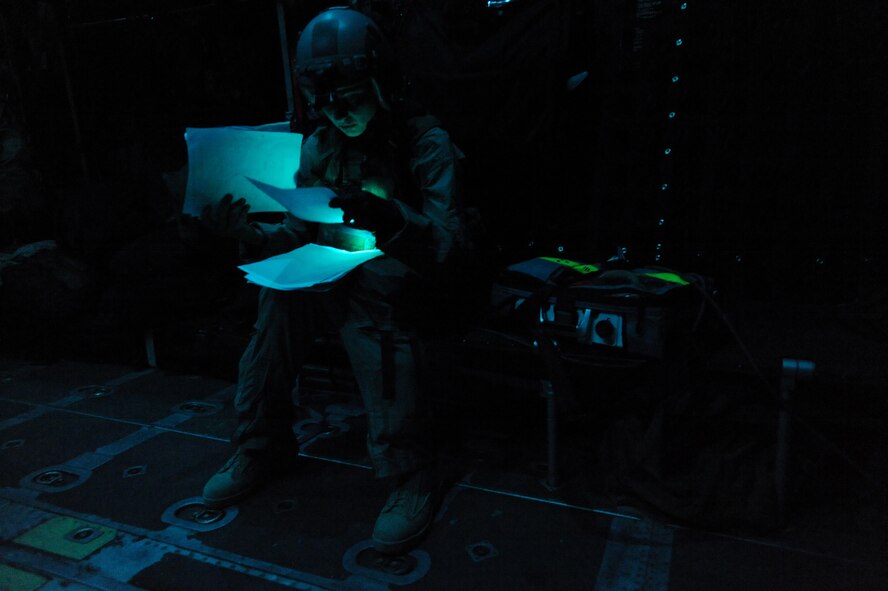 U.S. Air Force Capt. Susan Marchiano, a flight doctor assigned to the 79th Expeditionary Rescue Squadron, looks over a wounded U.S. Armed Forces member's treatment notes, while he is being transported to a field hospital aboard an HC-130P Hercules aircraft, April 12, 2010, in Afghanistan. (U.S. Air Force photo/Staff Sgt. Manuel J. Martinez/Released) 

