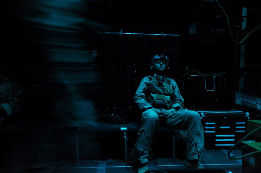 U.S. Air Force Capt. Susan Marchiano, a flight doctor assigned to the 79th Expeditionary Rescue Squadron, catches some sleep before arriving at a pick-up location for a severely wounded U.S. Servicemember she will care for while he is transported to a hospital aboard an HC-130P Hercules aircraft, April 12, 2010, over Afghanistan. (U.S. Air Force photo/Staff Sgt. Manuel J. Martinez/Released) 

