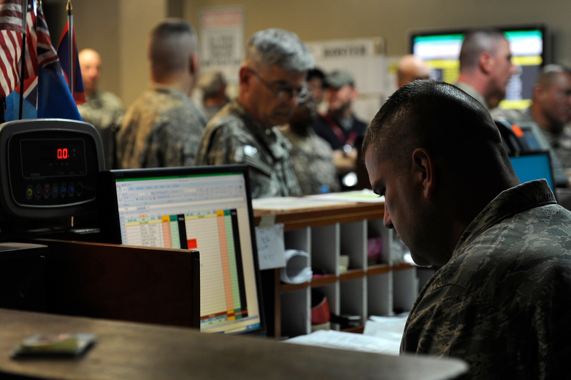 U.S. Air Force Tech Sgt. James Pickel, 455th Expeditionary Aerial Port Squadron, manifests personnel on aircraft flying throughout Southwest Asia, at Bagram Airfield, Afghanistan, April 14, 2010. Sergeant Pickel is deployed from Travis Air Force Base, Calif., and is from Knoxville, Tenn. (U.S. Air Force photo by/ Tech. Sgt. Jeromy K. Cross/released)
