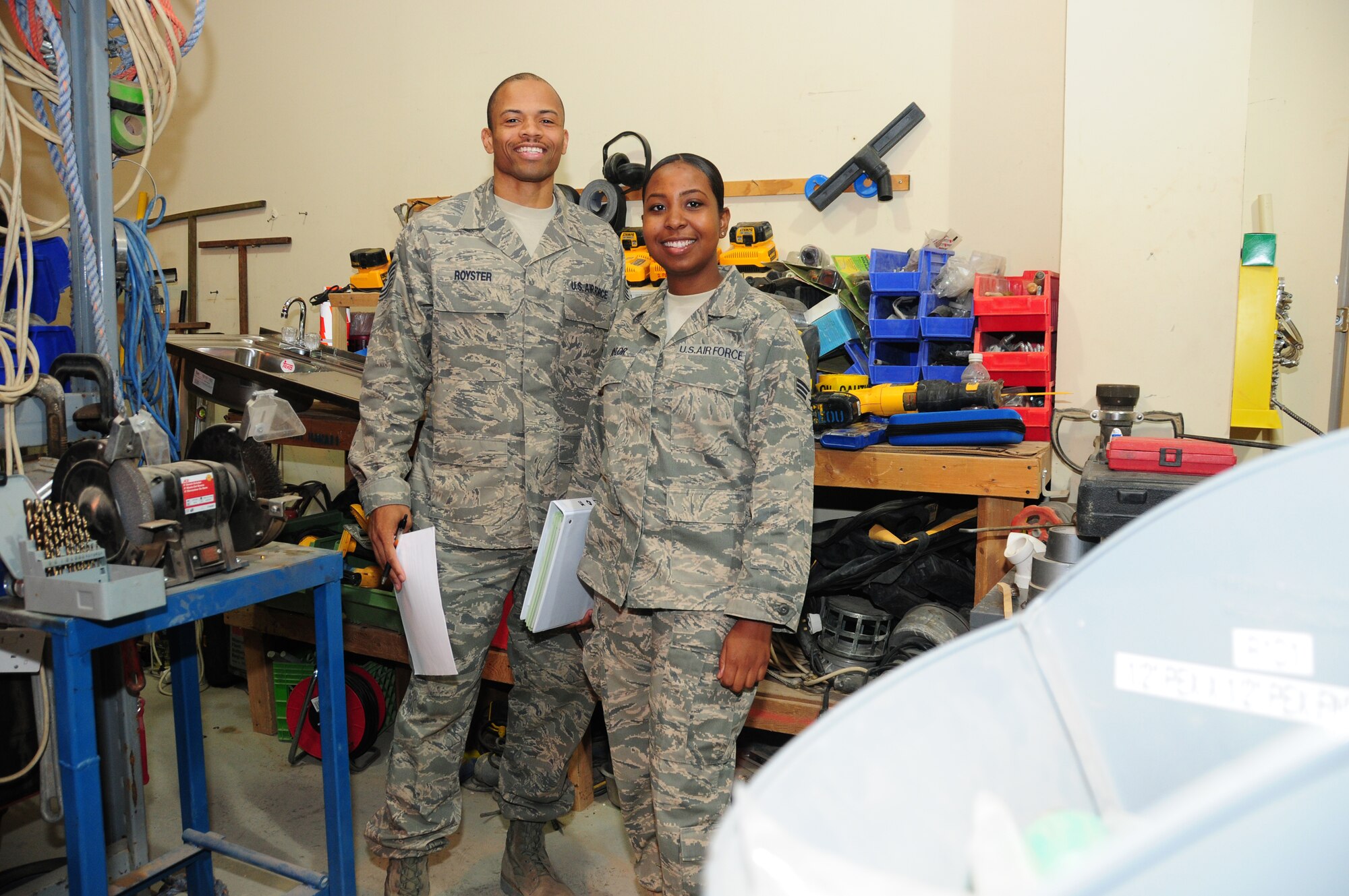 SOUTHWEST ASIA -- U.S. Air Force Tech. Sgt. Michael Royster and Senior Airman Rivera Taylor, both of the 386th Expeditionary Logistics Readiness Squadron Equipment Accountability office, work as liaisons between the U.S. Air Forces Central Command headquarters and the 65 equipment custodians here ensuring proper accountability of the 386th Air Expeditionary Wing's more than 2,800 assets valued at more than $32 million. (U.S. Air Force photo by Staff Sgt. Lakisha Croley/Released)