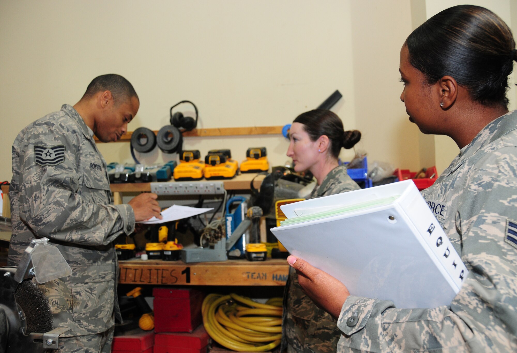 SOUTHWEST ASIA -- U.S. Air Force Senior Airman Rivera Taylor, 386th Expeditionary Logistics Readiness Squadron Equipment Accountability equipment liaison, observes as Tech. Sgt. Michael Royster, 386th ELRS Equipment Accountability NCO in charge, conducts an organization visit with Tech. Sgt. Lyndella Talamanco, 386th Expeditionary Civil Engineer Squadron equipment custodian, April 15, 2010 at an air base in Southwest Asia. (U.S. Air Force photo by Staff Sgt. Lakisha A. Croley/Released) 