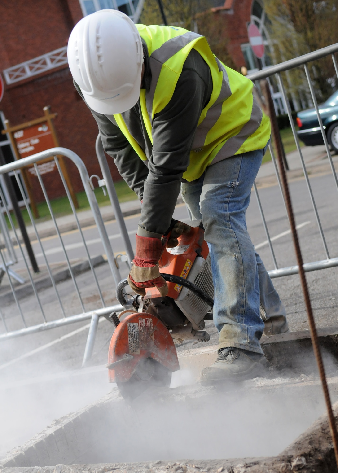 RAF MILDENHALL, England – Contract worker Paul Wiseman uses a slab cutter to remove pieces of concrete to make room for a new sidewalk being built at the Galaxy Club parking lot April 14. (U.S. Air Force photo/ Staff Sgt. Jerry Fleshman)