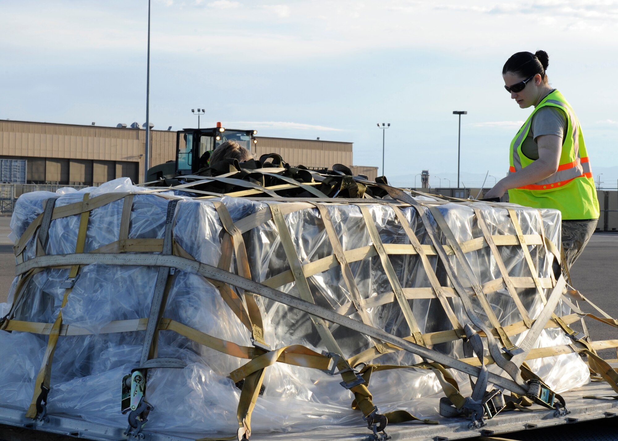 HOLLOMAN AIR FORCE BASE, N.M. -- Airman 1st Class Wendi Ballew, 49th Logistics Readiness Squadron, inspects palletized cargo as part of the Phase I exercise April 14, 2010. Members of Team Holloman routinely participate in exercises such as this one to practice their readiness to deploy at a moment's notice. (U.S. Air Force photo by Airman 1st Class Eileen Payne / Released)