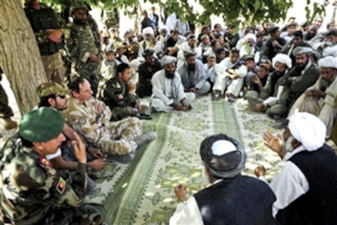 International Security Assistance Force Deputy Commander, British Lt. Gen. Nick Parker, attends a shura with government of the Afghanistan officials to assess the needs and capabilities of the people living in Qa Ryeh Sirakin, a village in Farah Province, April 7, 2010. Gen. Parker also met with Afghan, Italian and American forces during his two-day visit to the Farah province. 

