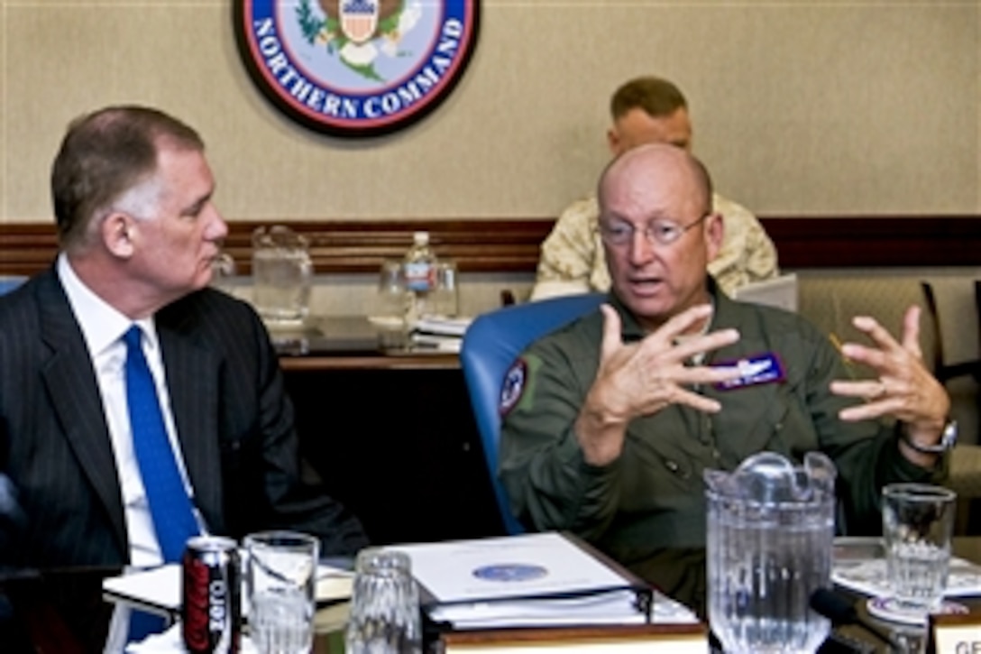 Air Force Gen. Gene Renuart, right, commander of U.S. Northern Command and North American Aerospace Defense Command, speaks with Deputy Defense Secretary William J. Lynn III during a command briefing roundtable on Peterson Air Force Base, Colorado Springs, Colo., April 14, 2010. 