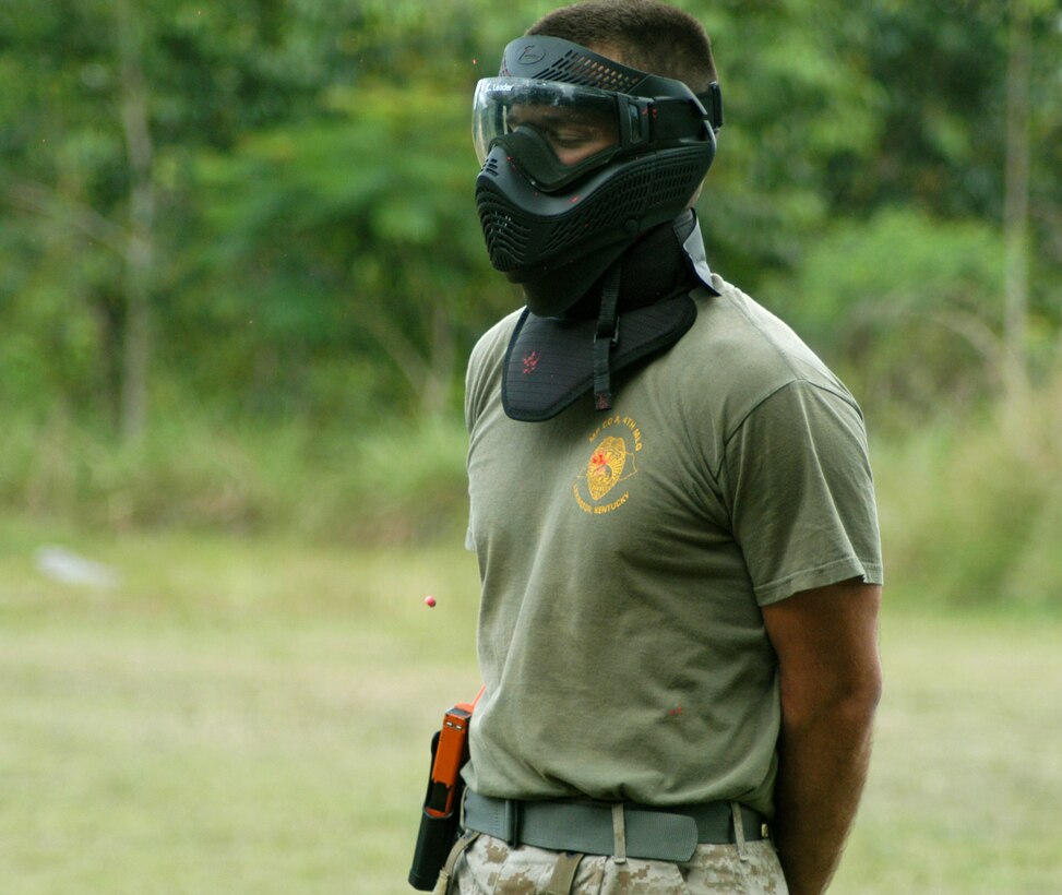 Marine Cpl. Jason Hettmansperger, a military policeman from Military Police Co. A, Lexington, KY awaits impact as a plastic simulation round projectile is just inches of striking his torso during U.S. Federal Bureau of Investigation led, week-long course teaching students to act/react quickly under real life circumstances. Tradewinds 2010, a Chairman of the Joint Chiefs directed, U.S. Southern Command sponsored annual exercise that is conducted with Caribbean Basin Partner Nations, designed to improve cooperation with the partner nations in responding to regional security threats.