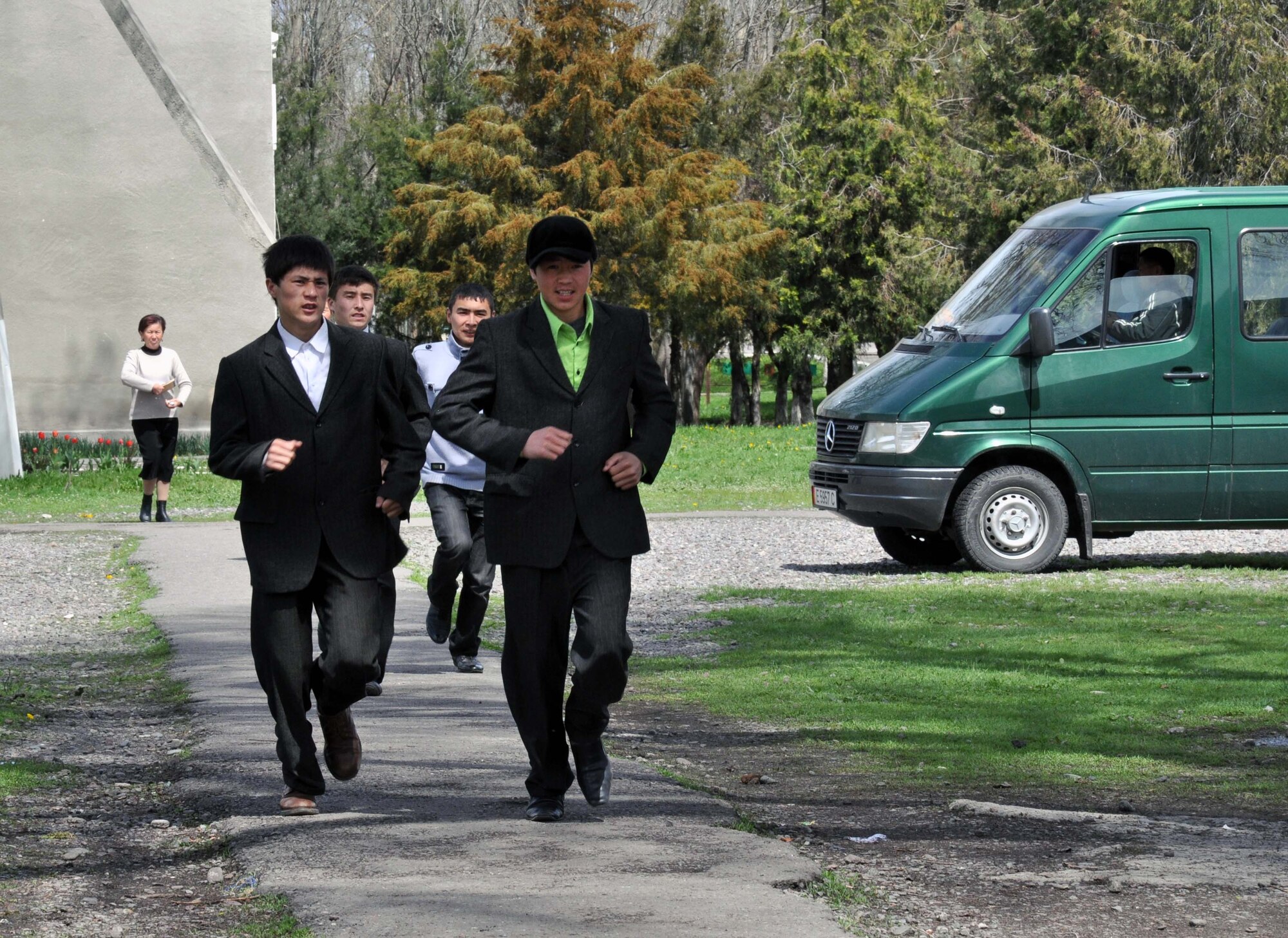 Students at the Panfilovskaya Boarding School/Orphanage, Kyrgyzstan, run to meet Transit Center at Manas Airmen who visited April 16, 2010, to deliver food and see what the school needs. Hosting 250 children ages 6 to 18, the school needs sponsors to help improve facilities and education. (U.S. Air Force photo/Staff Sgt. Carolyn Viss)