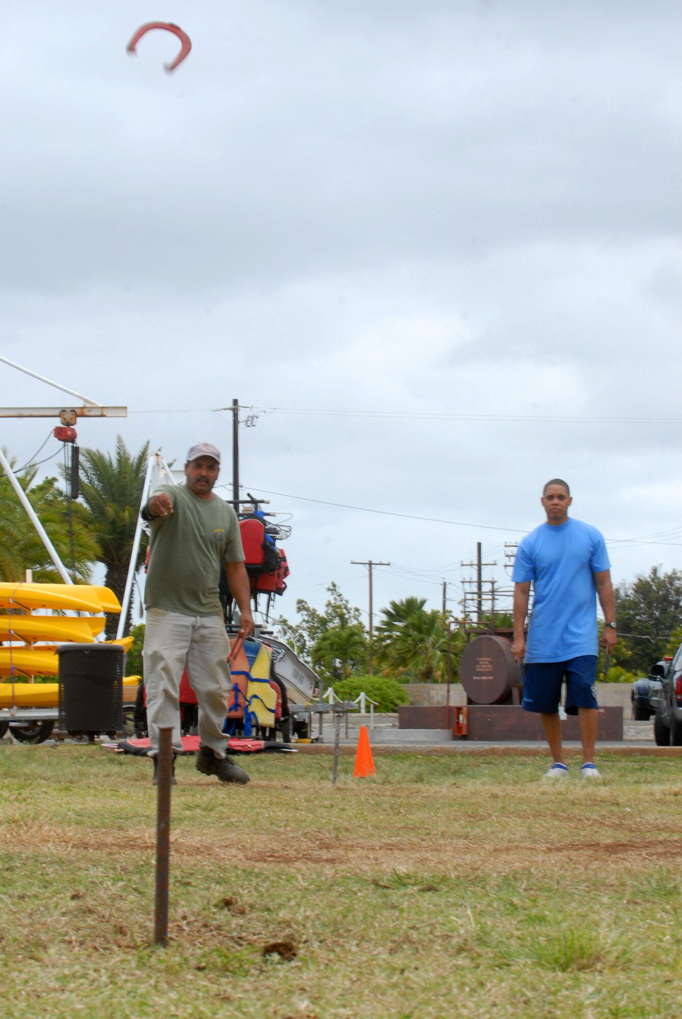 JOINT BASE PEARL HARBOR HICKAM, Hawaii – David Silva, 15th Civil Engineer Squadron, takes aim at the post in a game of Horseshoe during the Team Hickam Sports Day here, April 16. (U.S. Air Force photo/Senior Airman Gustavo Gonzalez)