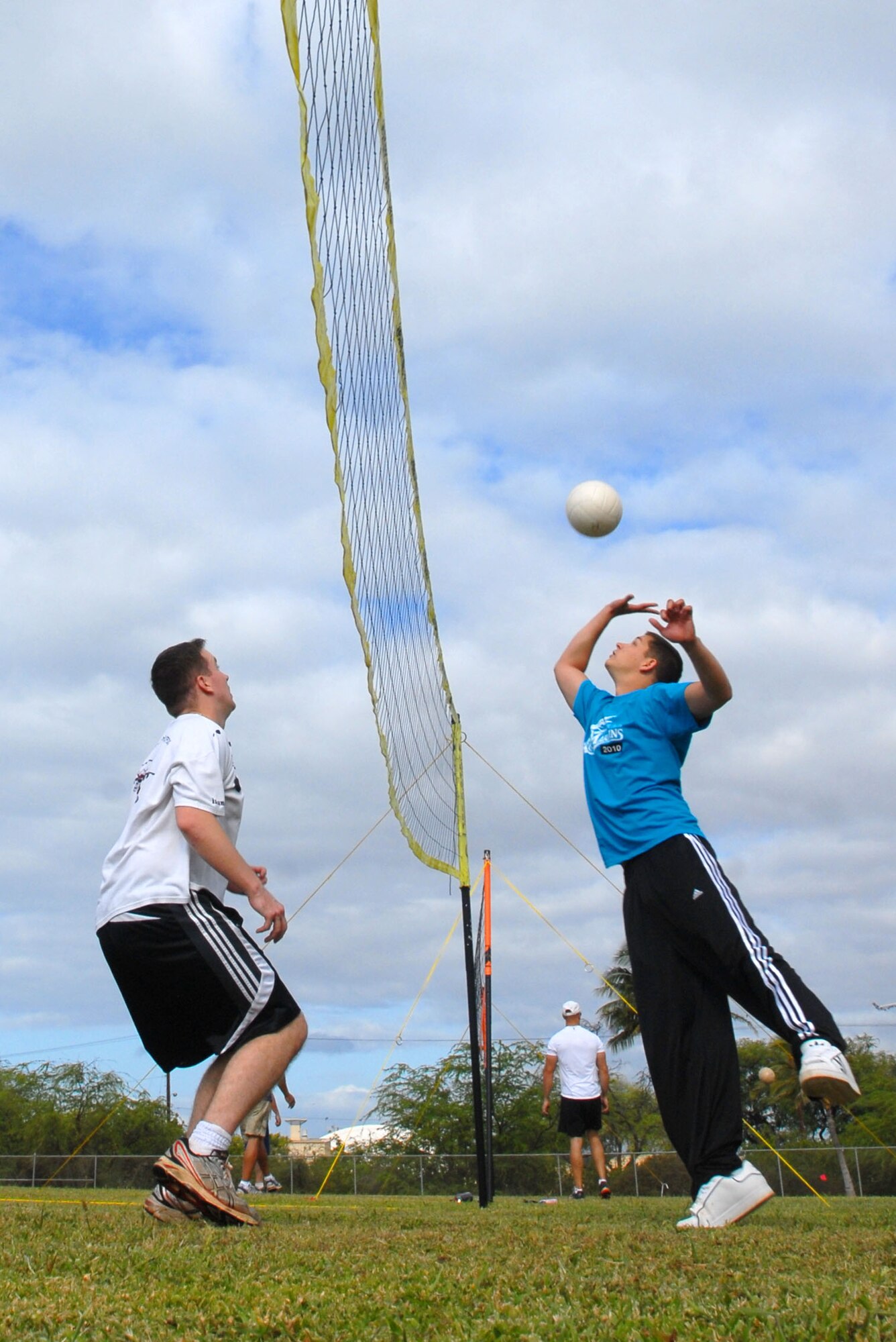 JOINT BASE PEARL HARBOR HICKAM, Hawaii – Senior Airman Zachary Eyl, 15th Comptroller Squadron, attempts to spike the ball during a volleyball game as part of the Team Hickam Sports Day here, April 16. (U.S. Air Force photo/Senior Airman Gustavo Gonzalez)