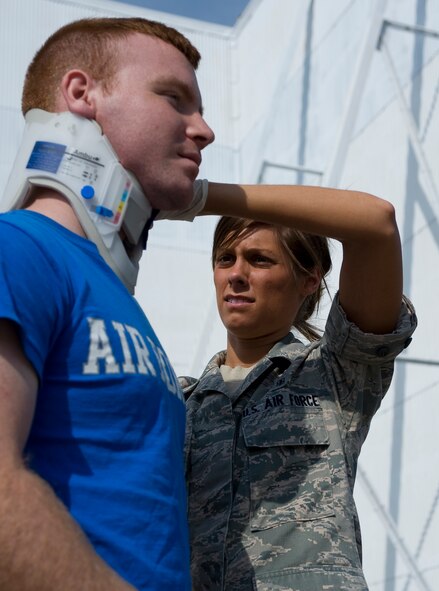 BARKSDALE AIR FORCE BASE, La. – Airman 1st Class Bryenna Brooks, 2d Medical Operations Squadron, provides care for a simulated injury during a Major Accident Response Exercise here April 16. The MARE was conducted to test the readiness of emergency response personnel in the event of an accident during the upcoming air show. (U.S. Air Force photo by Airman 1st Class Chad Warren) (RELEASED)