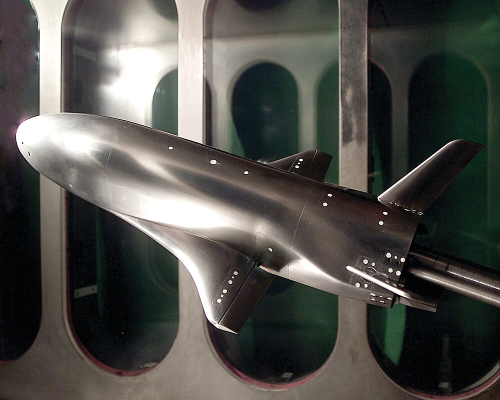 A wind tunnel test in VKF used a 6-percent scale model of Boeing’s X-37 to investigate the aerodynamic forces and moments of the vehicle and aerodynamic jet interaction effects from plumes of small reaction control system jets on the model.