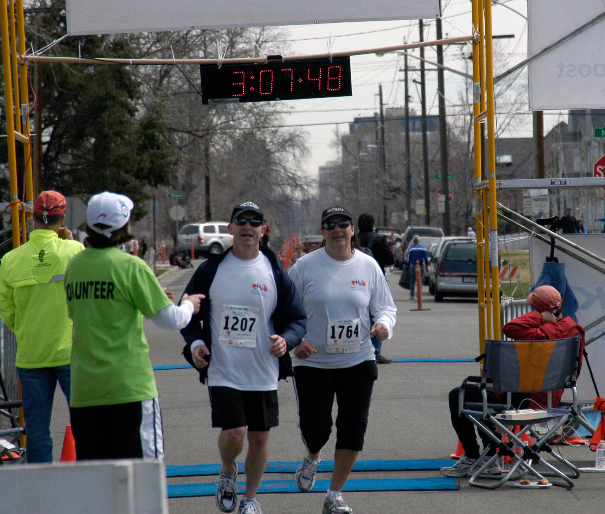Lt. Col. Doug Ottinger, director of assignments at the Air Reserve Personnel Center, and his wife Lynette, cross the finish line during the Platte River Half Marathon in Denver on April 11. Eleven ARPC Airmen and their family members were amongst the more than 1,500 who participated in the event. (U.S. Air Force photo/Mike Molina)                                