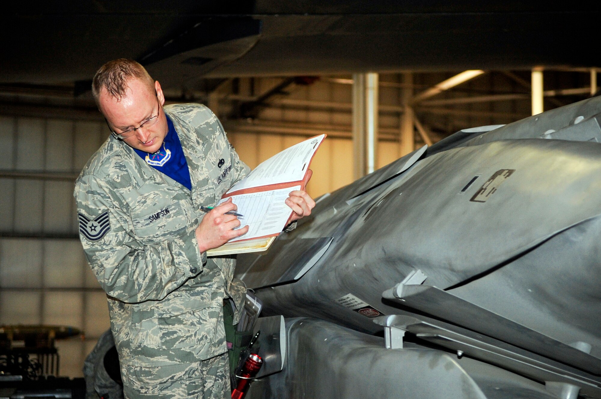Tech. Sgt. Brenton Sampson participates in a load crew competition April 13, 2010, at Minot Air Force Base, N.D. Sergeant Sampson is a 5th Aircraft Maintenance Squadron load crew member. (U.S. Air Force photo/Staff Sgt. Stacy Moless)