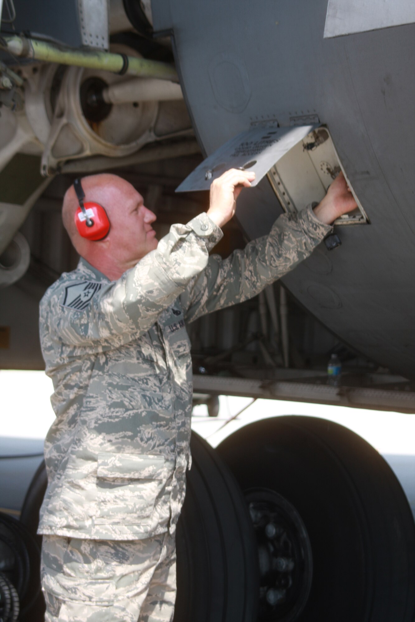 WRIGHT-PATTERSON AIR FORCE BASE, Ohio - Master Sgt. John Wagenbach, III, 445th Aircraft Maintenance Squadron, is checking the external hydraulics of a C-5 Galaxy while preparing the aircraft for a mission April 12.  (U.S. Air Force photo/Staff Sgt. Amanda Duncan)