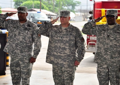 (Right to left) Outgoing Army Support Activity Command Sgt. Maj. Jeffery Miller, Col. Martin Clausen, ASA Commander, and incoming ASA Command Sgt. Maj. Clayton Crooks, salute the colors during a change of responsibility ceremony April 14 at Soto Cano Air Force Base, Honduras. ASA provides selected Expeditionary Base Operation Support to Joint Task Force-Bravo and other organizations here to enhance operational focus and readiness and quality of life.