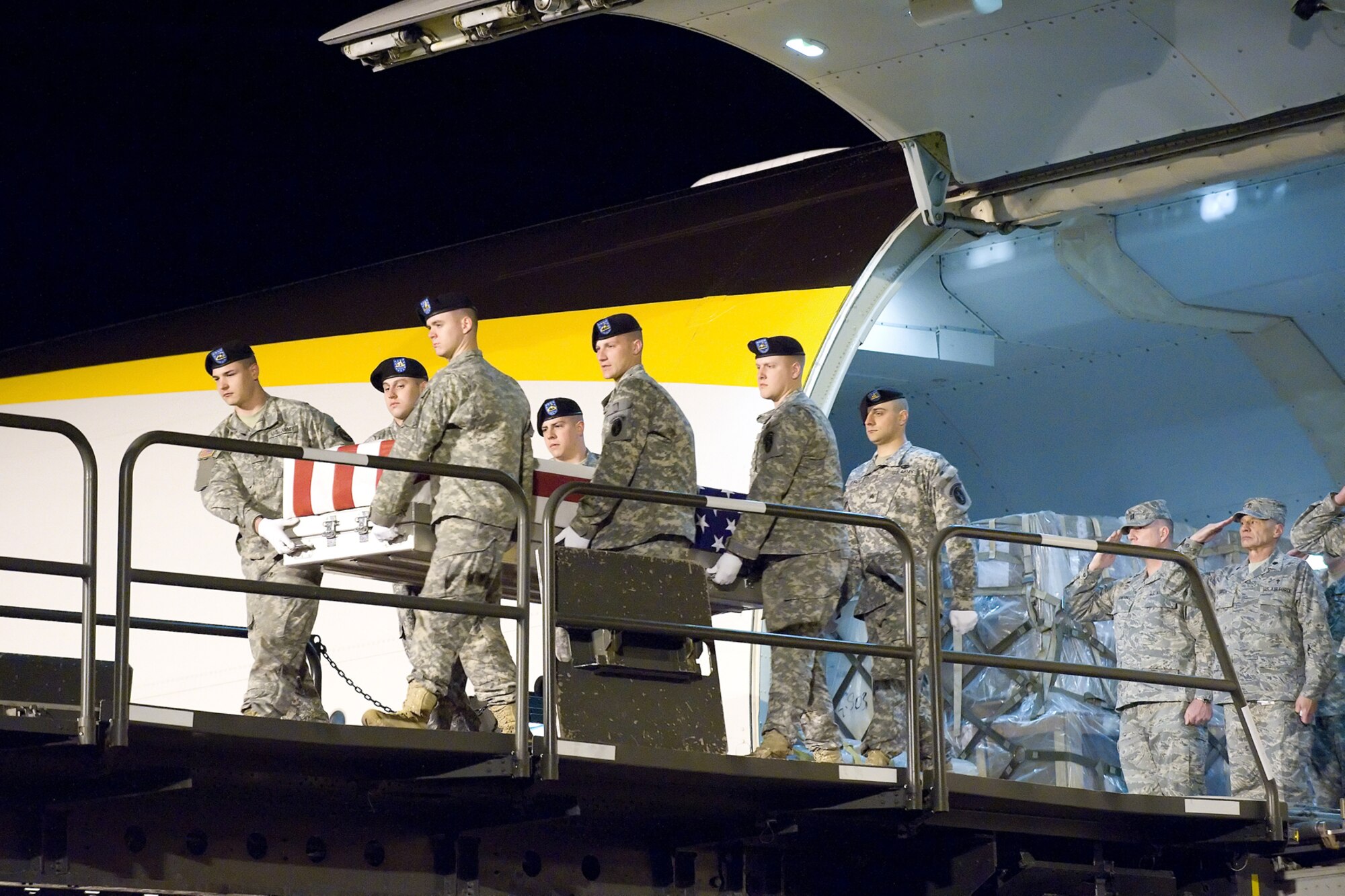 A U.S. Army carry team transfers the remains of Army 1st Lt. Robert W. Collins of Tyrone, Ga., at Dover Air Force Base, Del., on April 9, 2010. He died April 7 in Mosul, Iraq, when enemy forces attacked his vehicle with an improvised explosive device. Collins was assigned to the 1st Battalion, 64th Armor Regiment, 2nd Brigade Combat Team, Fort Stewart, Ga.  