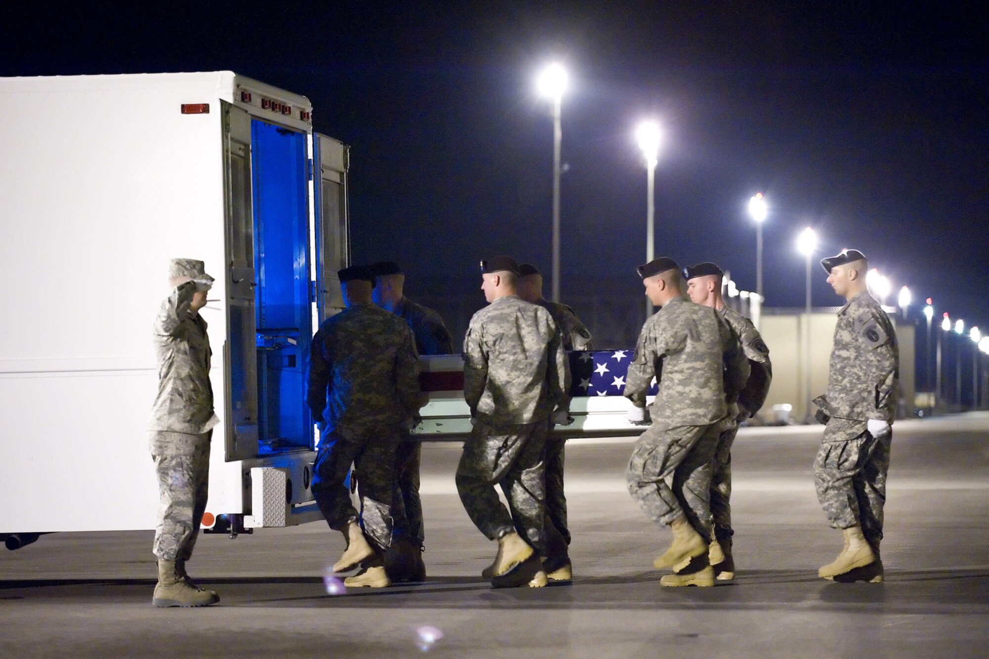A U.S. Army carry team transfers the remains of Army Pfc. William A. Blount of Petal, Miss., at Dover Air Force Base, Del., on April 9, 2010. He died April 7 in Mosul, Iraq, when enemy forces attacked his vehicle with an improvised explosive device. Blount was assigned to the 1st Battalion, 64th Armor Regiment, 2nd Brigade Combat Team, Fort Stewart, Ga. (U.S. Air Force photo/Jason Minto)