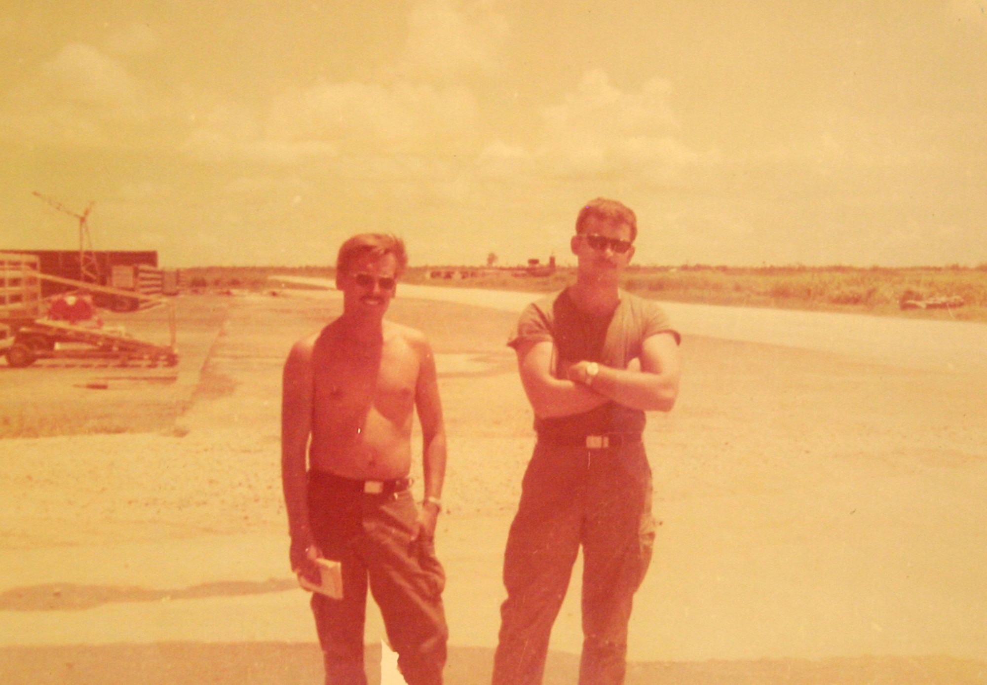 Staff Sgt. Jerry Kmieciak(left) and Senior Airman Mike Donovan at Binh Thuy Air Base, Vietnam. The two were wounded when a grenade was tossed by men from a passing scooter.