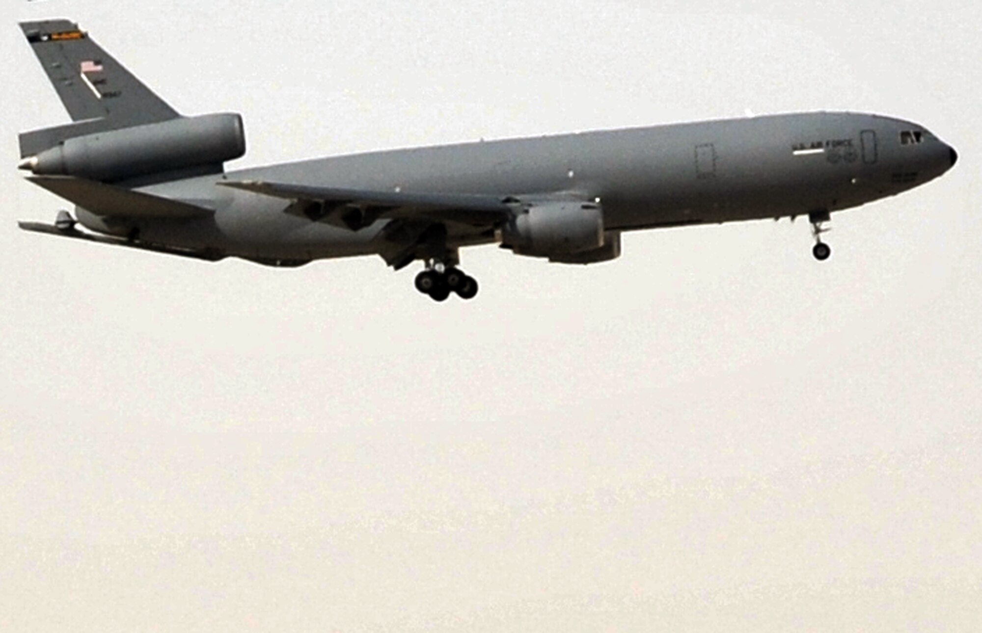 A flight crew guides a KC-10 Extender from the 908th Expeditionary Air Refueling Squadron in for a landing at a non-disclosed base in Southwest Asia on April 16, 2010. The KC-10s deployed to Southwest Asia with the 908th EARS and the 380th Air Expeditionary Wing are from Joint Base McGuire-Dix-Lakehurst, N.J., and Travis Air Force Base, Calif.  The KC-10 is the Air Force's largest tanker and in 2009, aircraft assigned to the 908th EARS flew more than 4,700 combat missions offloading more than 422 million pounds of fuel to more than 31,400 aircraft. (U.S. Air Force Photo/Master Sgt. Scott T. Sturkol/Released)