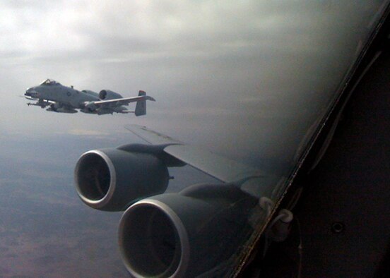 Altus AFB, Okla. - Operating the A-10 Thunderbolt II, U.S. Air Force Col. William DeMaso, vice commander of the 23rd Wing at Moody Air Force Base, Ga., flies parallel to younger brother U.S. Air Force Maj. Lewis DeMaso, a KC-135 Stratotanker pilot with the 54th Air Refueling Squadron at Altus Air Force Base, March 21. Colonel DeMaso received fuel from his brother Major DeMaso for his A-10 during his return trip from Tucson back to Moody AFB. The DeMaso brothers are from Maspeth, N.Y. (U.S. Air Force Courtesy Photo/Release 97th Air Mobility Wing- Public Affairs)
