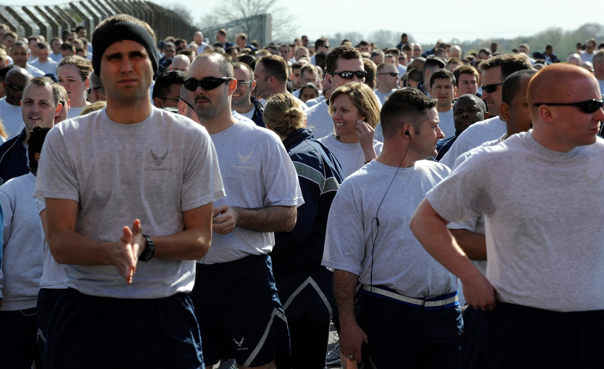 RAF MILDENHALL, England -- RAF Mildenhall Airman and their friends, family and pets walk to the starting line of the Team Mildenhall 5K Fun Run near the Hardstand Fitness Center April 16. Hundreds of 100th Air Refueling Wing and tenant unit Airmen participated in the monthly run.  (U.S. Air Force photo/Staff Sgt. Christopher L. Ingersoll)