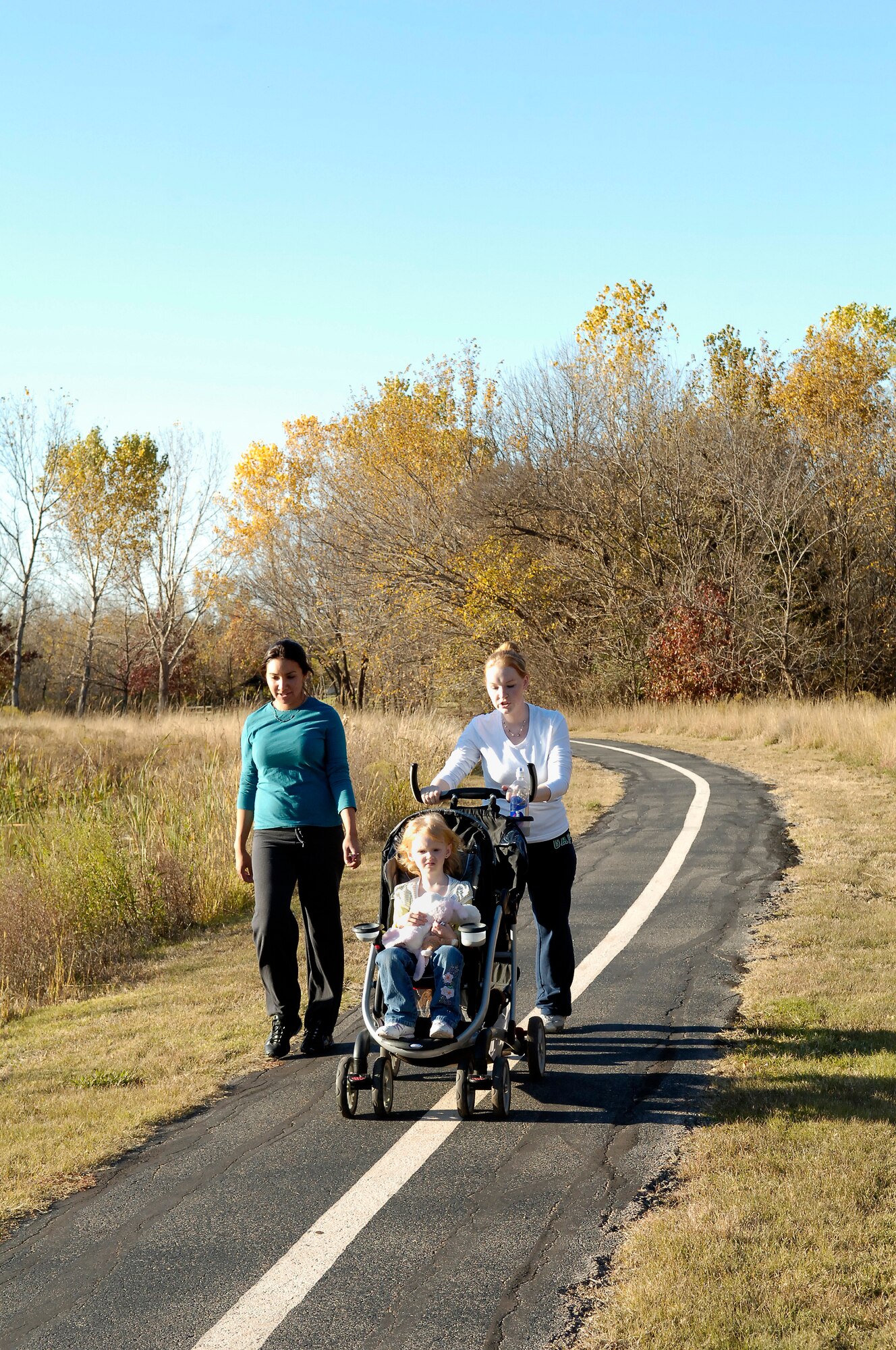 Walkers enjoy a trail through some of Tinker’s Urban Greenway which was designed and set aside to help increase the quality of life for base residents. (Air Force photo by Kelly White)