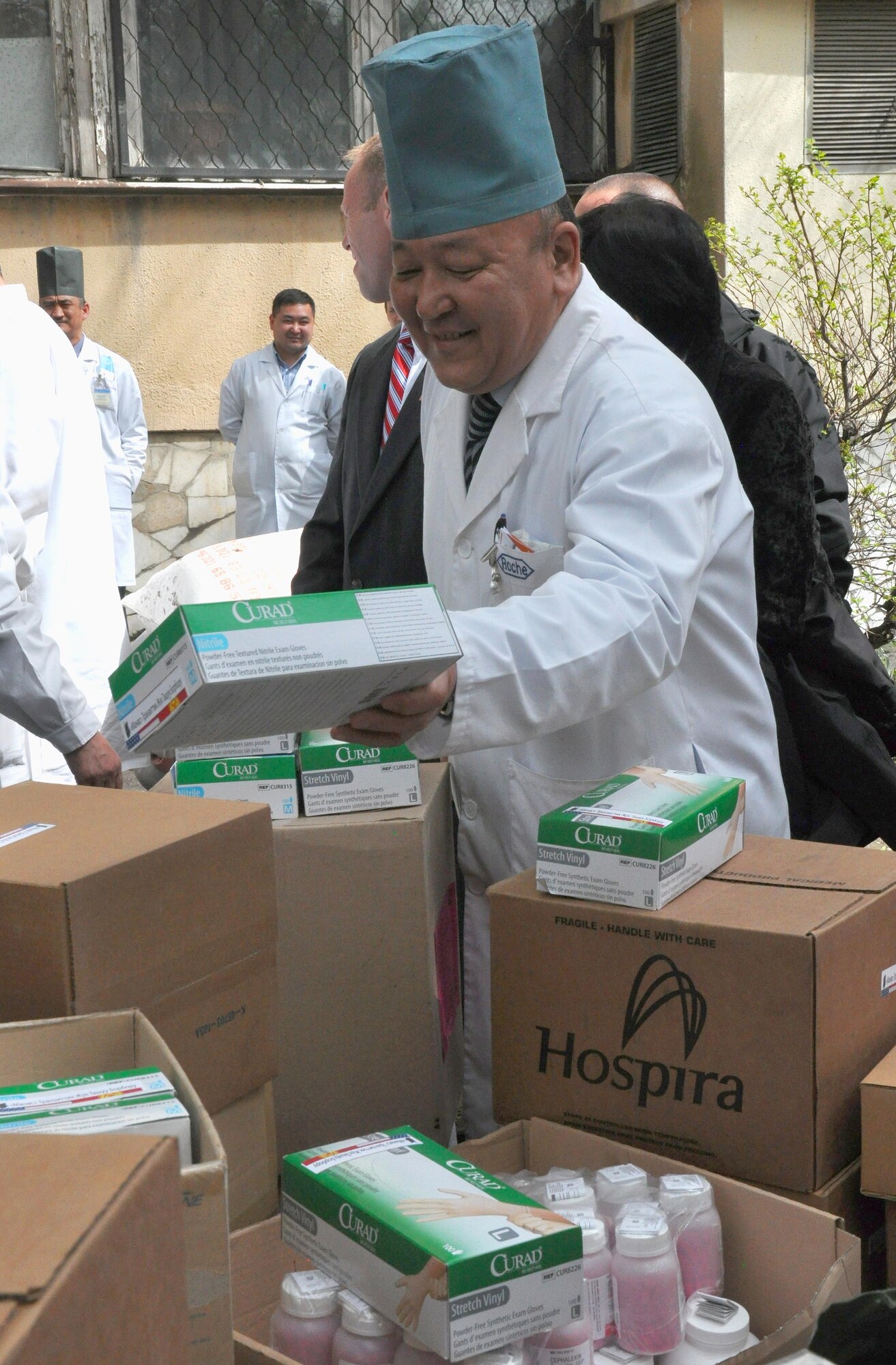 Professor Sabyrbek Djumadekov, the Chief Director of the Center for Traumatology, happily looks through needed medical supplies donated to the National Hospital in Bishkek, Kyrgyzstan, from the Transit Center at Manas April 15, 2010. This is a continuation of efforts started just a couple of days ago when 16,000lbs ? approximately $82,000 worth ? of supplies including bandages, sutures, antibiotics, and antiseptics, were delivered to the Transit Center at Manas from the U.S. Army Medical Material Center, Southwest Asia. (U.S. Air Force photo/Staff Sgt. Carolyn Viss)