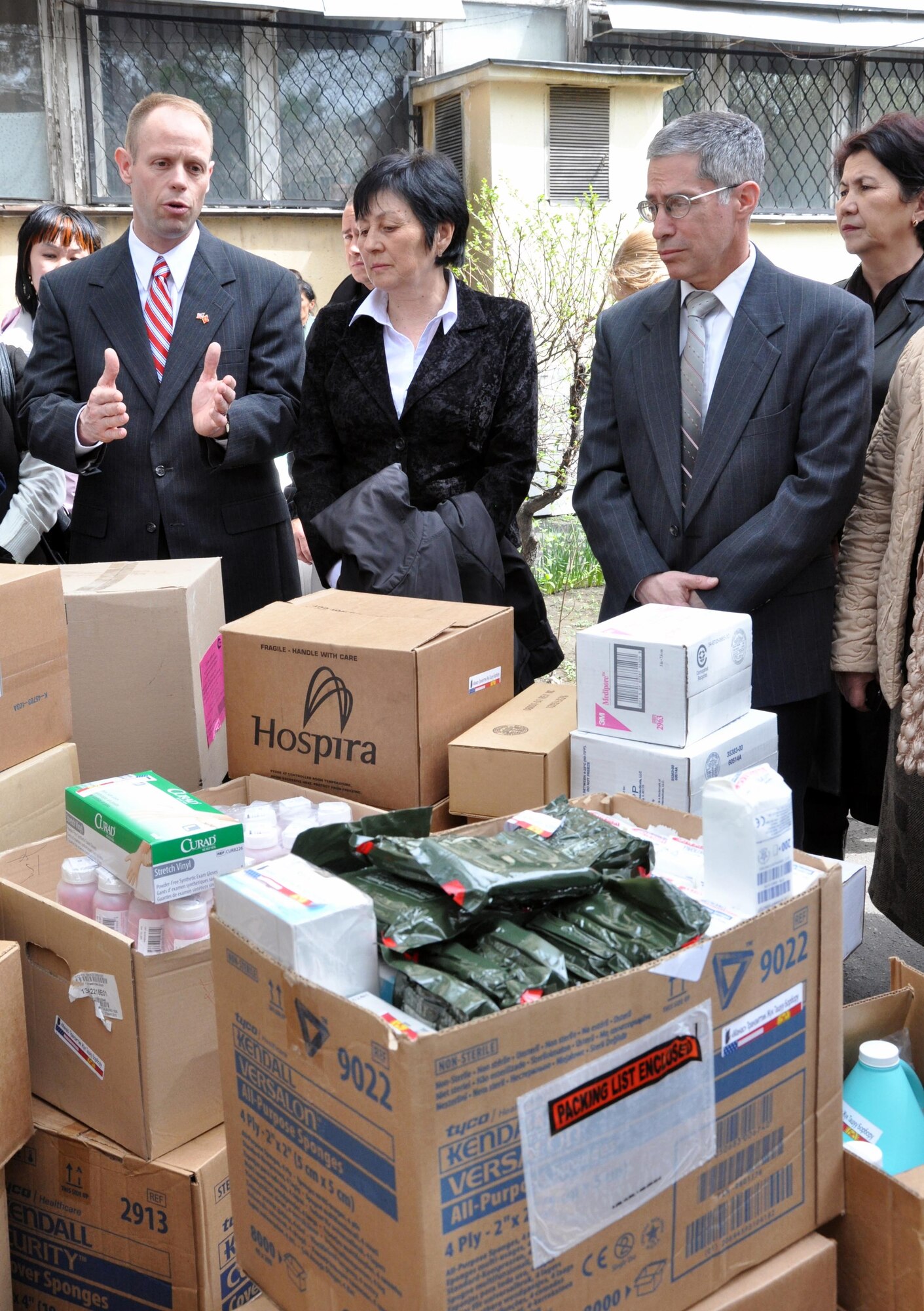 Col. Blaine Holt, director of the Transit Center at Manas, Kyrgyzstan , left, speaks to a crowd of Kyrgyz patients, doctors, media, and town leaders about the medical supplies and food the Airmen donated to the National Hospital in Bishkek, Kyrgyzstan April 15, 2010. This is a continuation of efforts started just a couple of days ago when 16,000lbs ? approximately $82,000 worth ? of supplies including bandages, sutures, antibiotics, and antiseptics, were delivered to the Transit Center at Manas from the U.S. Army Medical Material Center, Southwest Asia. (U.S. Air Force photo/Staff Sgt. Carolyn Viss)