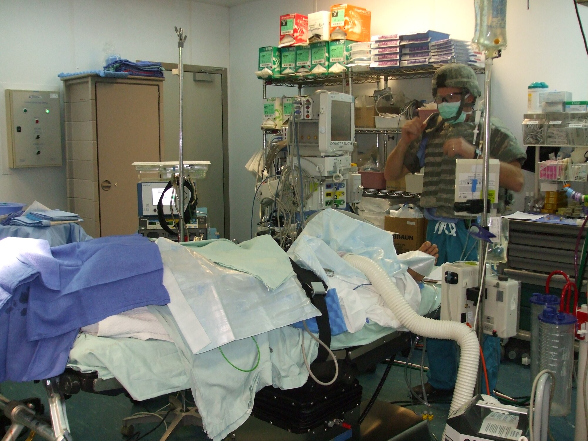 Technical Sgt. William Carter, 88th Air Base Wing Medical Center’s surgical operation squadron, checks supplies and medical equipment in the operating room at Bagram Airfield, Afghanistan.  Sergeant Carter played an integral role in removing an unexploded ordnance from the head of an Afghan soldier.
