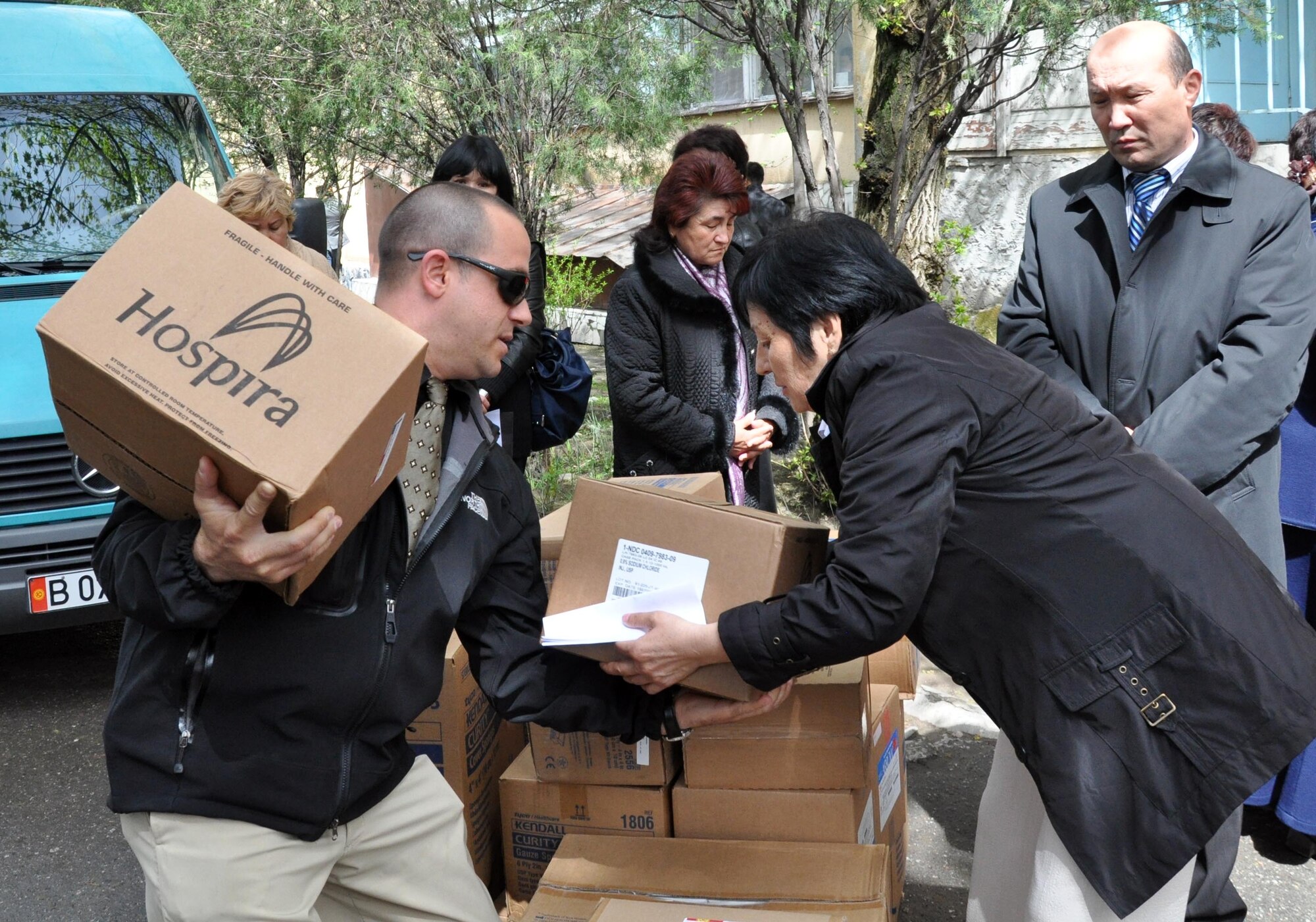 Jeff Villemarette carries needed medical supplies to the National Hospital in Bishkek, Kyrgyzstan, from the Transit Center at Manas. Airmen delivered medical supplies and food to two Bishkek hospitals April 15, 2010, and visited with patients who were injured in last week?s unrest, which killed 83 and injured approximately 500. (U.S. Air Force photo/Staff Sgt. Carolyn Viss)