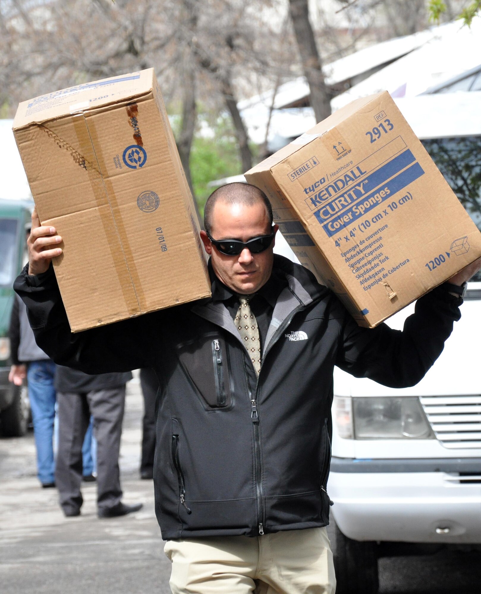 Jeff Villemarette carries needed medical supplies to the National Hospital in Bishkek, Kyrgyzstan, from the Transit Center at Manas. Airmen delivered medical supplies and food to two Bishkek hospitals April 15, 2010, and visited with patients who were injured in last week?s unrest, which killed 83 and injured approximately 500. (U.S. Air Force photo/Staff Sgt. Carolyn Viss)