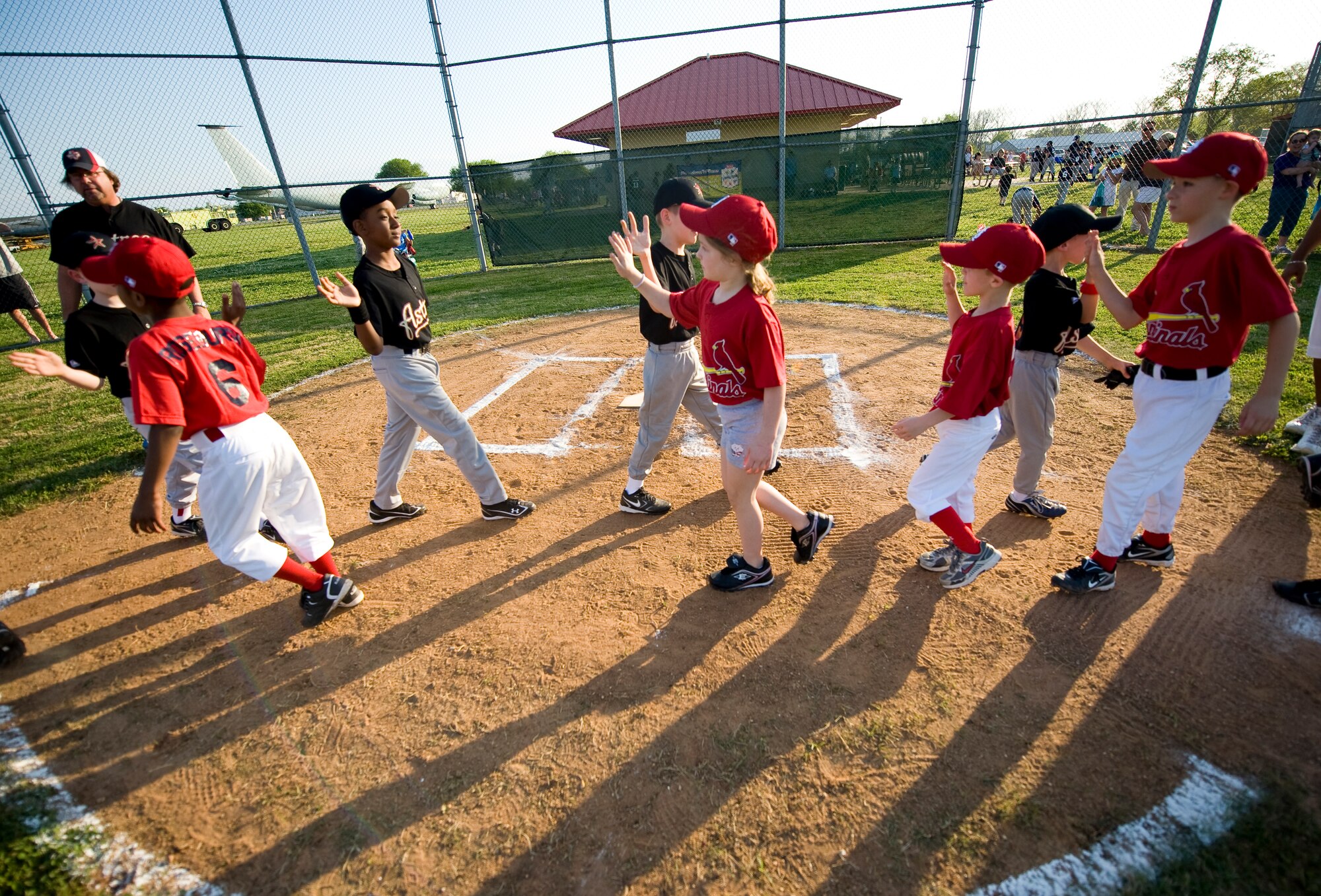 BARKSDALE AIR FORCE BASE, La. – Members of the 2010 Youth Baseball League congratulate each other following the first game of the season here April 13. This year, the league consists of 88 participants divided into eight teams. (U.S. Air Force photo by Airman 1st Class Chad Warren) (RELEASED)