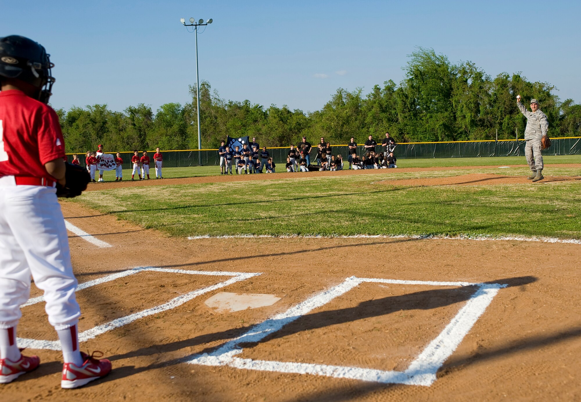 BARKSDALE AIR FORCE BASE, La. – Col. Rob Huber, 2d Mission Support Group commander, throws the first pitch during the opening ceremony of the 2010 Youth Baseball League April 13. This year, the league consists of 88 participants divided into eight teams. (U.S. Air Force photo by Airman 1st Class Chad Warren) (RELEASED)