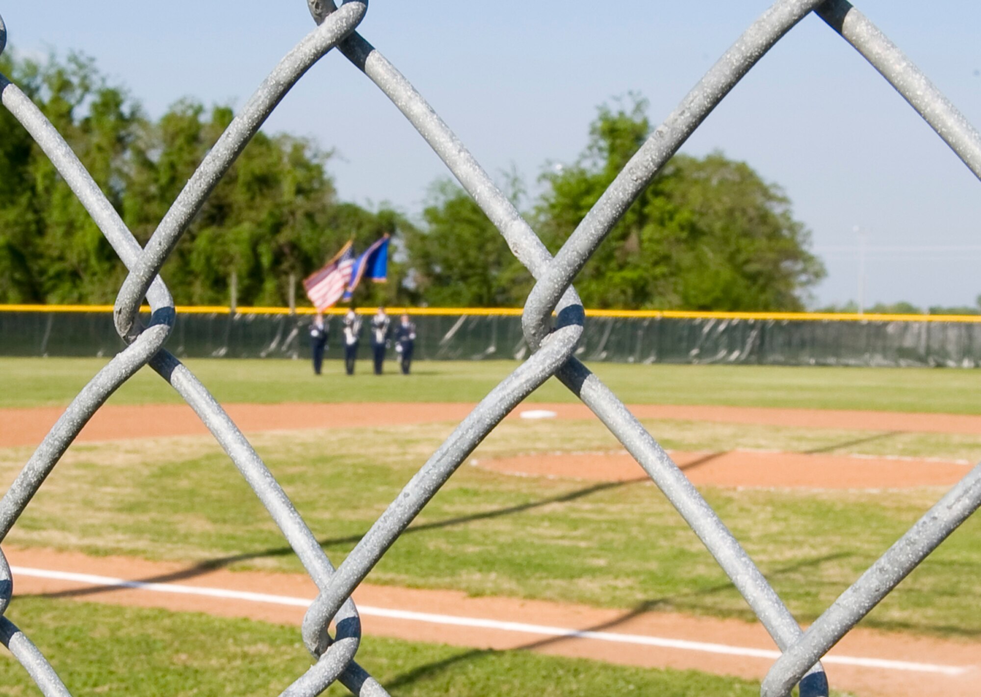 BARKSDALE AIR FORCE BASE, La. – Members of the base Honor Guard prepare to present the colors during the opening ceremony of the 2010 Youth Baseball League April 13. This year, the league consists of 88 participants divided into eight teams. (U.S. Air Force photo by Airman 1st Class Chad Warren) (RELEASED)
