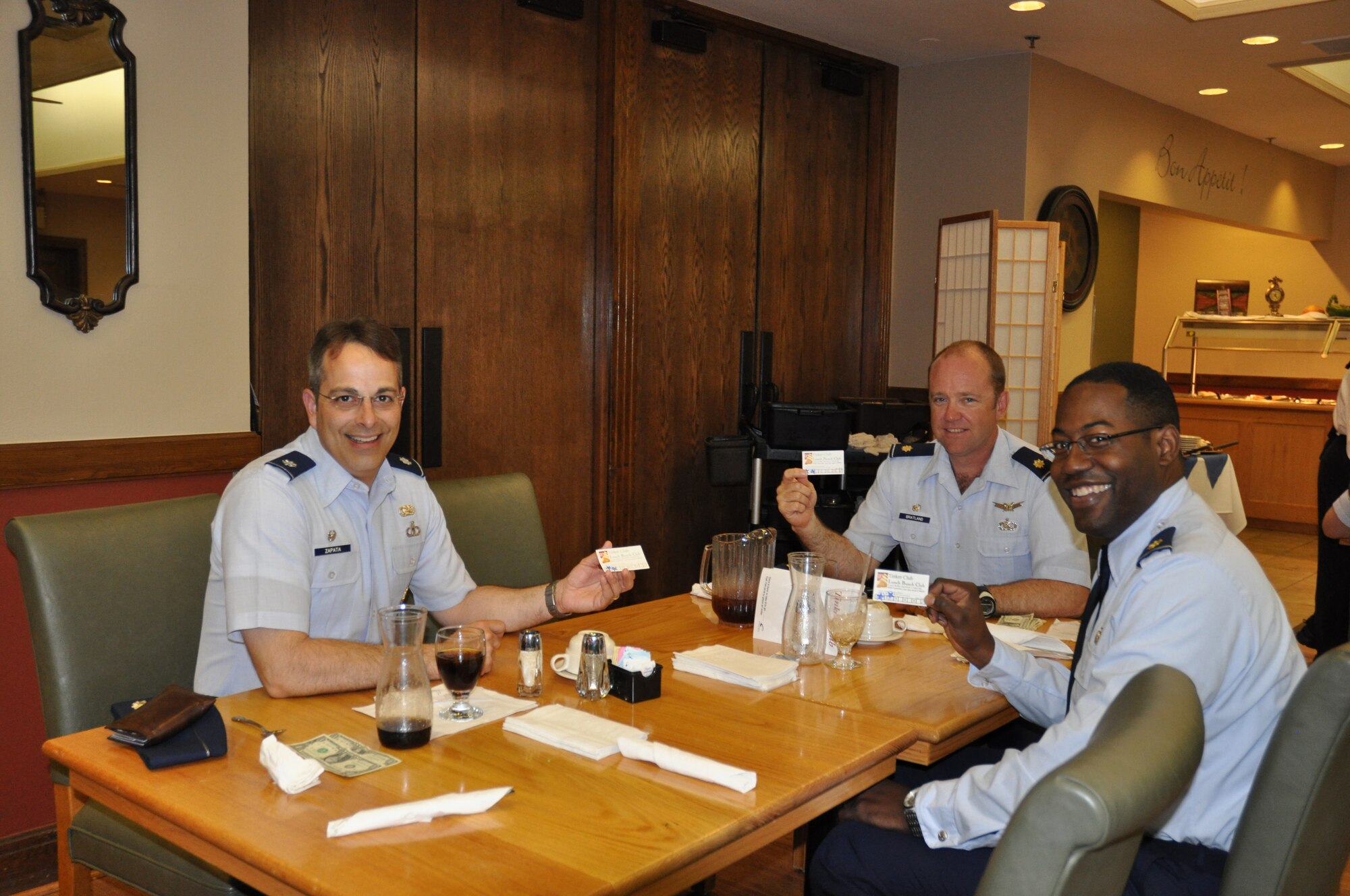 Three commanders within the 3rd Combat Communications Squadron are leading the way for their Airmen. From left, Lt. Col. John Zapata, 3rd Combat Communications Support Squadron commander;  Maj. Ken Bratland, 32nd Combat Communications Squadron commander; and Maj. Noland “LoJack” Greene, 34th Combat Communications Squadron commander, know the benefits of Tinker Club membership. Members who purchase five lunches and use their lunch bunch program card receive the sixth lunch free.