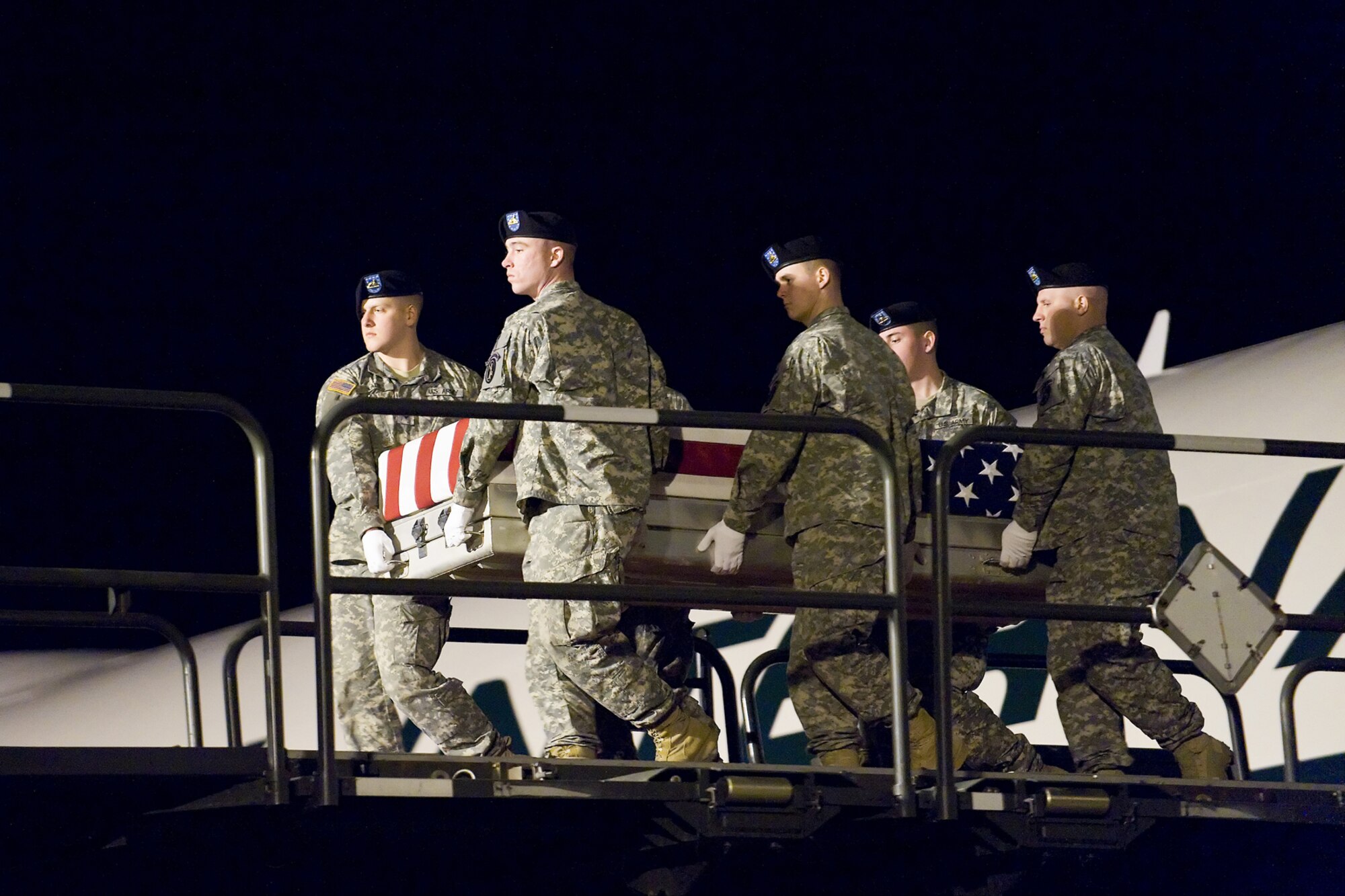 A U.S. Army carry team transfers the remains of Army Spc. Lakeshia M. Bailey, of Columbus, Ga., at Dover Air Force Base, Del., March 10. Spc. Bailey was assigned to 203rd Brigade Support Battalion, attached to the 1st Battalion, 10th Field Artillery Regiment, 3rd Brigade Combat Team, 3rd Infantry Division, Fort Benning, Ga. (U.S. Air Force photo/Roland Balik)