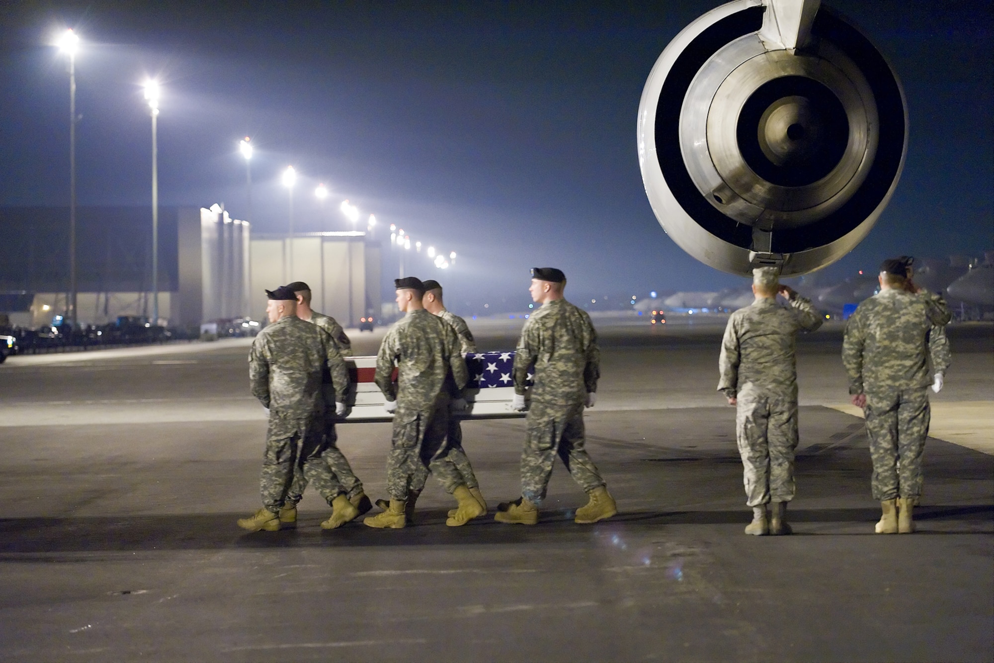 A U.S. Army carry team transfers the remains of Army Sgt. Aaron M. Arthur, of Lake City, S.C., at Dover Air Force Base, Del., March 10. Sgt. Arthur was assigned to 203rd Brigade Support Battalion, attached to the 1st Battalion, 10th Field Artillery Regiment, 3rd Brigade Combat Team, 3rd Infantry Division, Fort Benning, Ga. (U.S. Air Force photo/Roland Balik)
