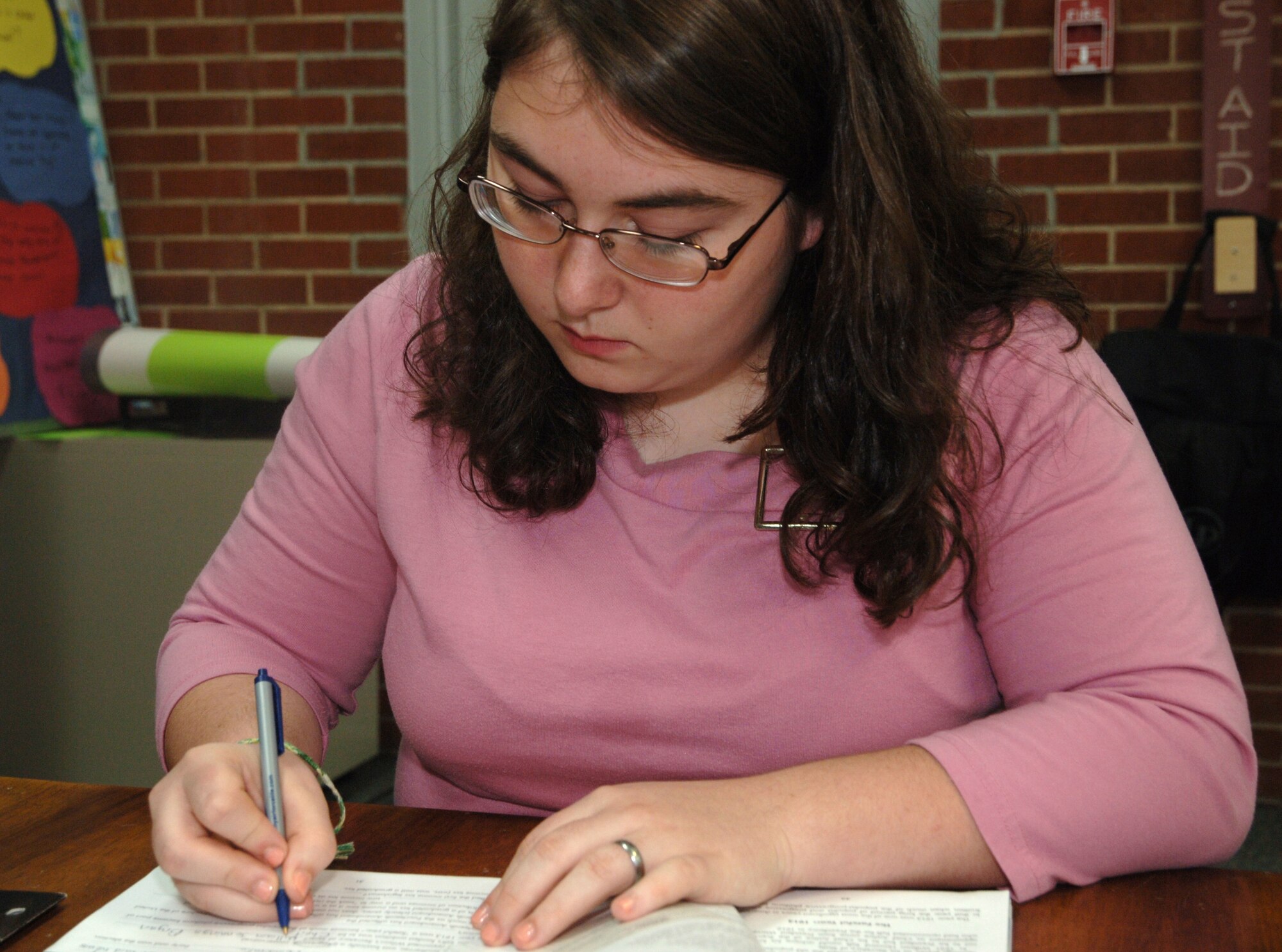 Grand Forks Air Force Base Youth of the Year, Michaela “Mikey” Murray, 15, works on her homework April 15 at the youth center. The Youth of the Year title was given to Mikey by the Boys & Girls Club of America for her sound character, leadership skills and willingness to give back to the community. (U.S. Air Force photo by Senior Airman R. Michael Longoria)   