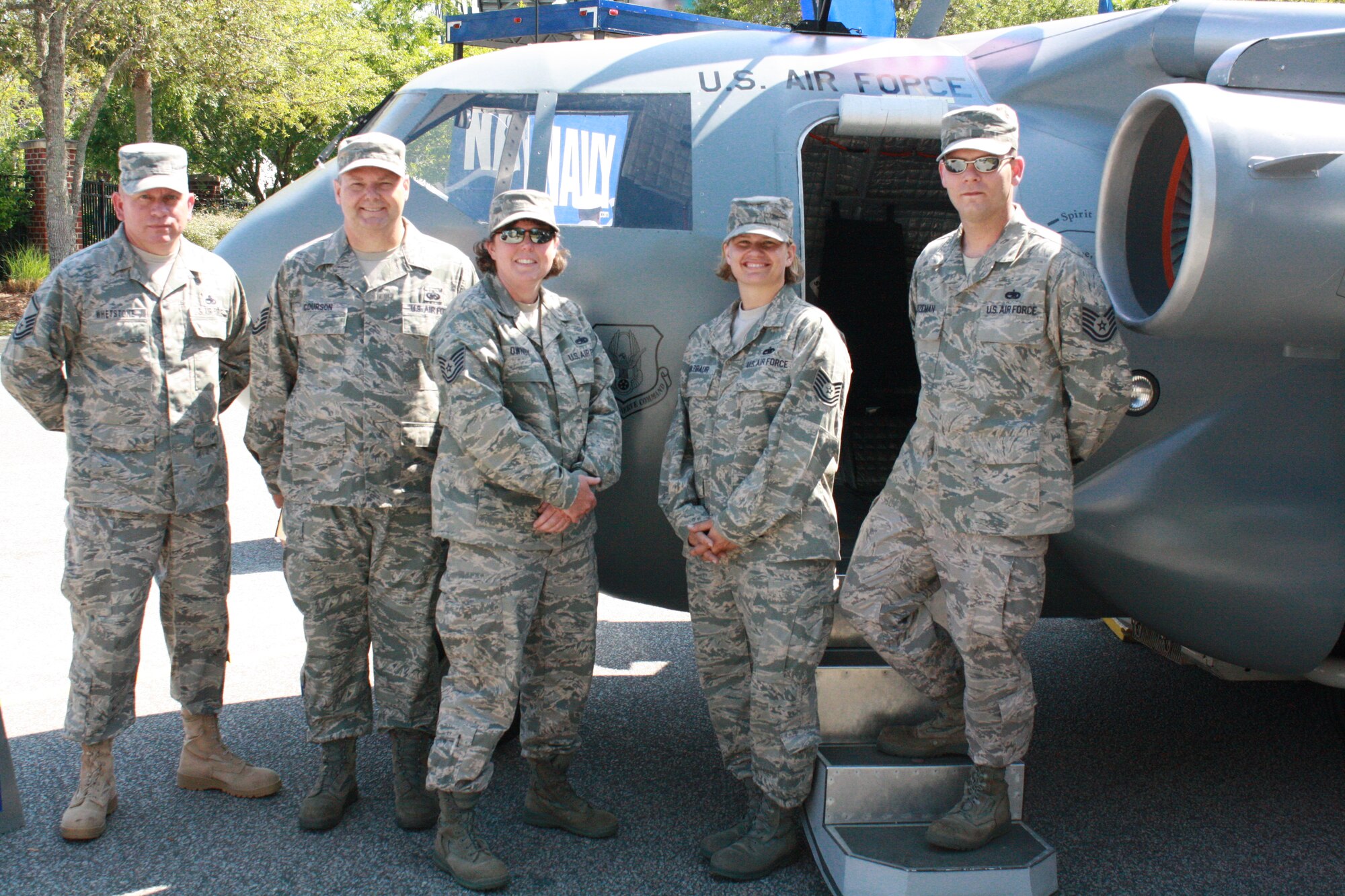 Members of the 315th Airlift Wing mini C-17 crew greeted visitors at the Family Circle Tennis Center in Charleston S.C.Monday April 12. From left to right; MSgt Marion Whetstone, MSgt Bailey Courson, TSgt Amy Ownby, TSgt Elizabeth Holzbaur and TSgt Brandon Bozeman from the 315th Airlift Wing Charleston Air Force Base S.C. give thier own time outside of their regular duties to inform the public about the Air Force Reserve. (U.S. Air Force photo)