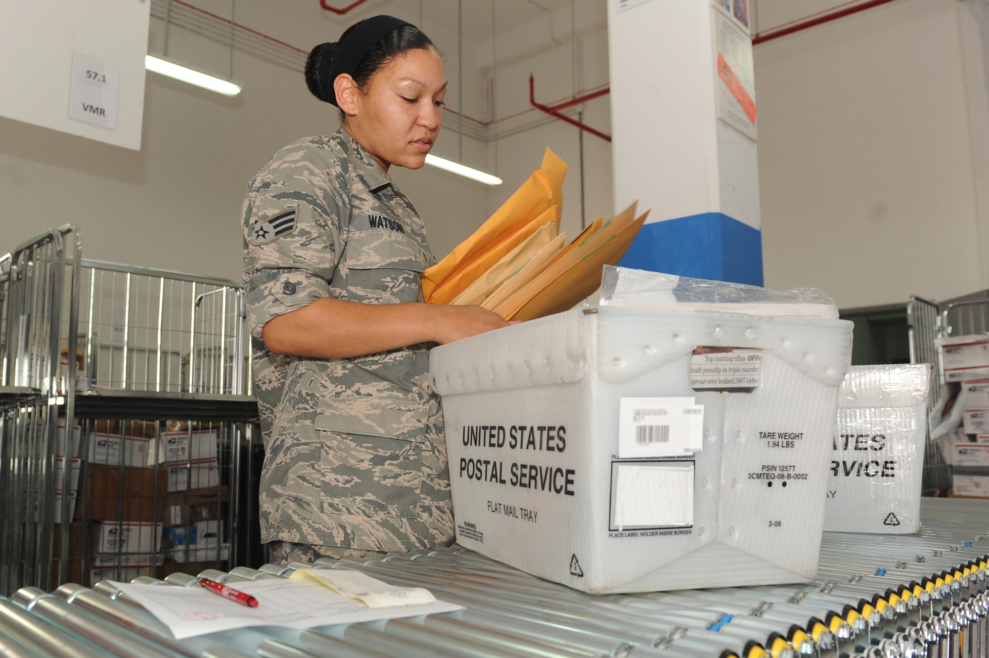 Senior Airman Charalene Watson, 379th Expeditionary Communications Squadron postal clerk, documents official business mail receipts at a non-disclosed Southwest Asia location, April 15, 2010. (U.S. Air Force photo by Tech. Sgt. Michelle Larche)[RELEASED]
